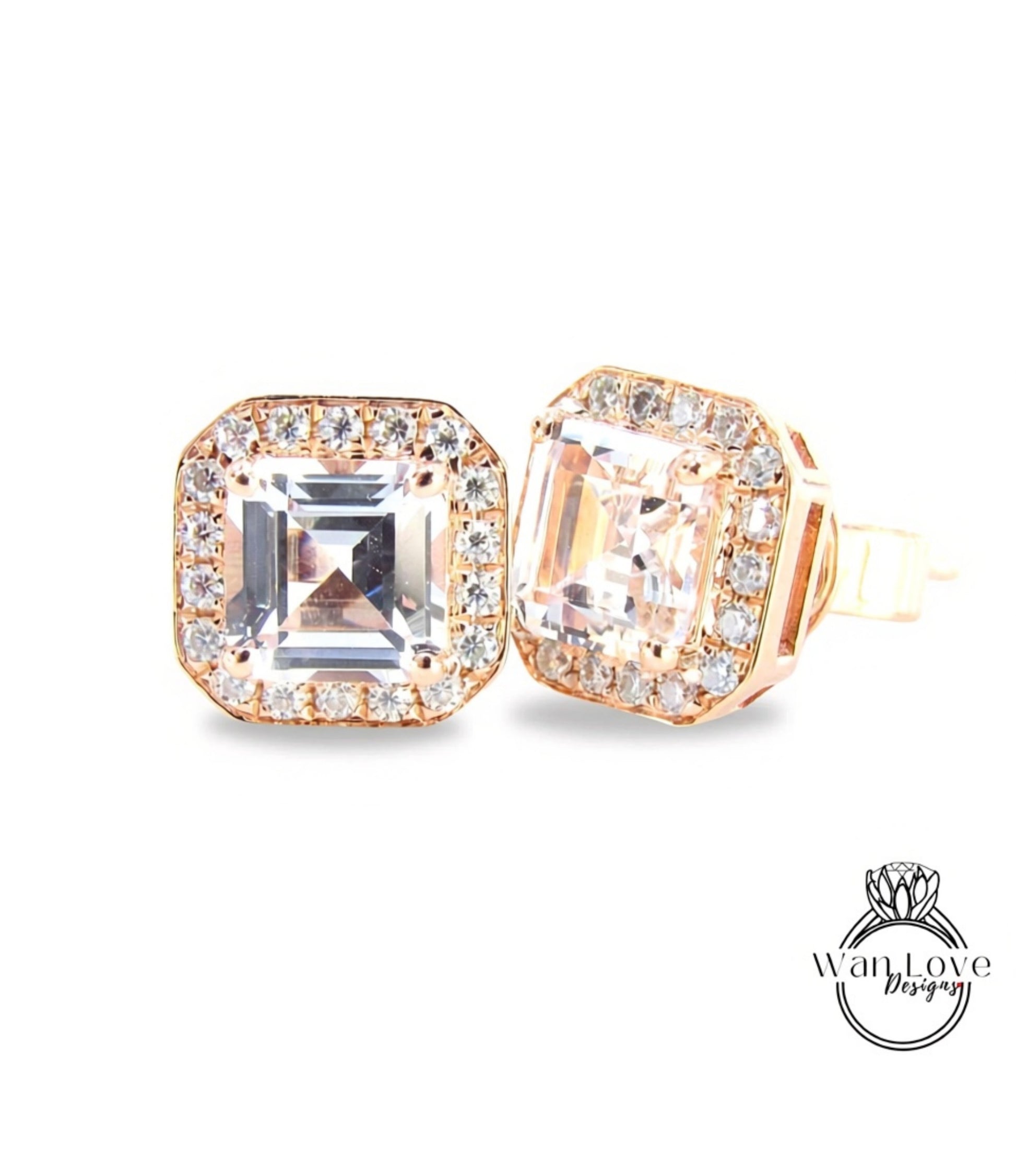 A pair of gold-toned earrings with large, clear gemstones set in a halo around the center.