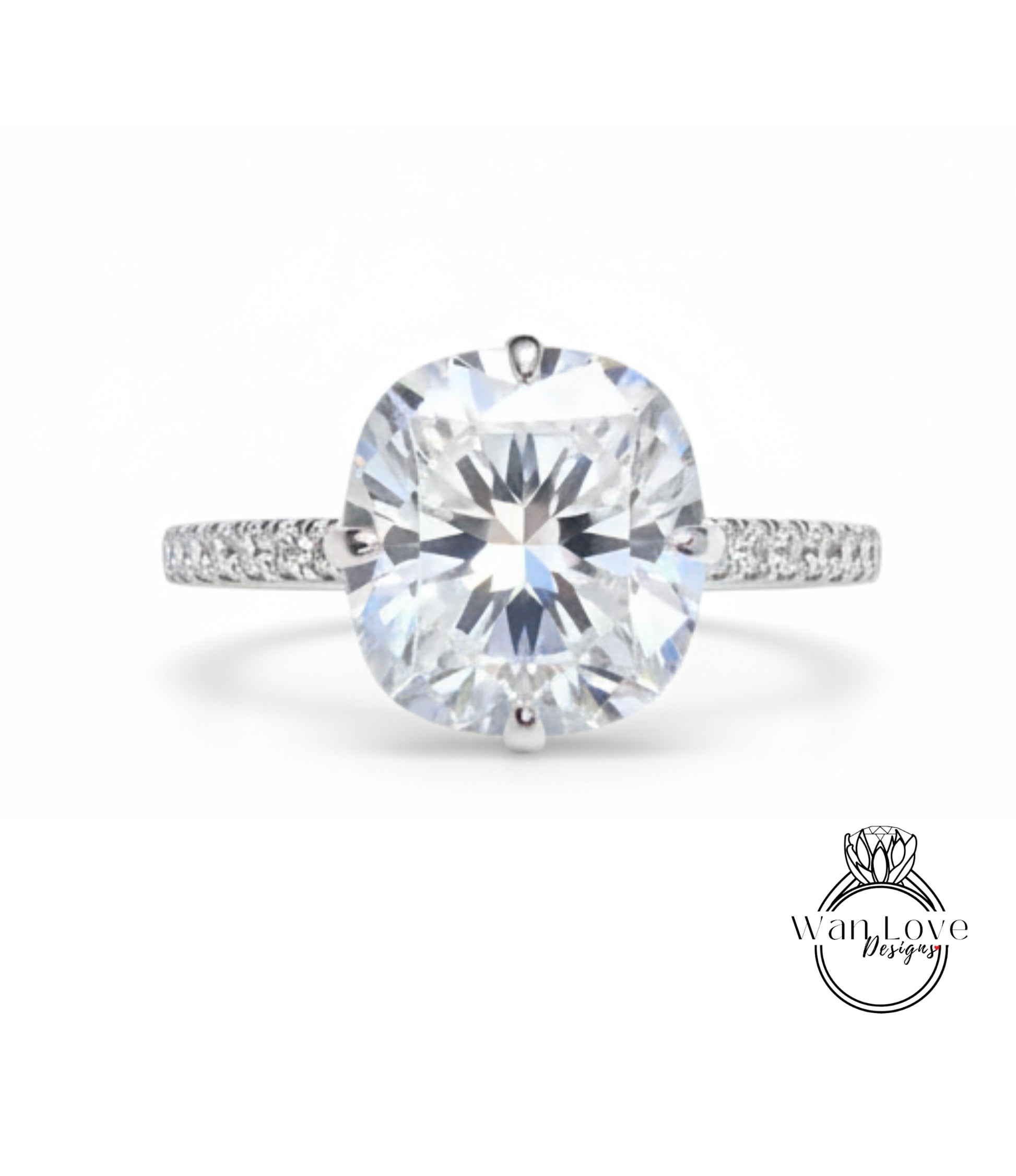 A large, round, brilliant-cut diamond engagement ring with a halo of smaller diamonds around the center stone.