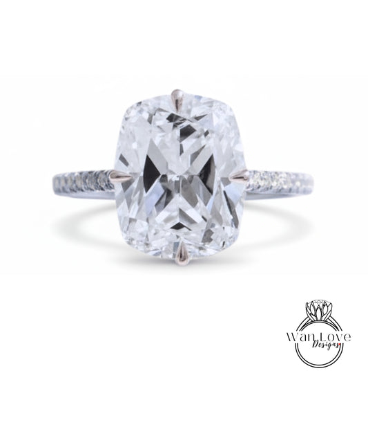 A large, clear diamond engagement ring with a prominent center stone.