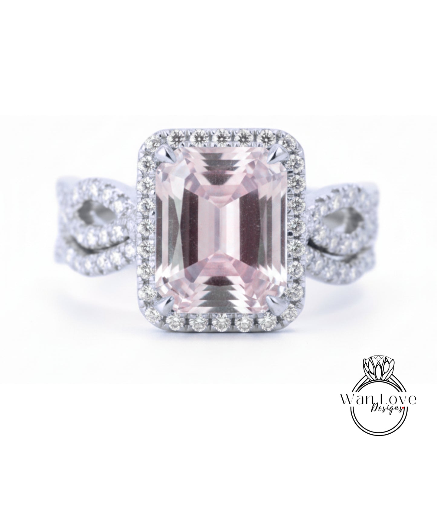 A large, pink gemstone ring with a halo of smaller diamonds around it, set in a silver band.