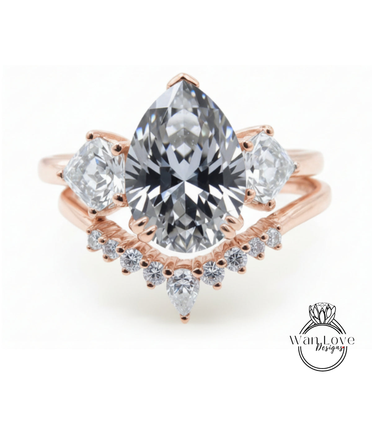 a beautiful engagement ring with a large pear-shaped diamond set in a rose gold band, surrounded by smaller diamonds.
