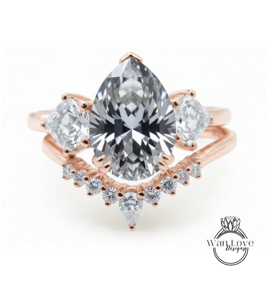 a beautiful engagement ring with a large pear-shaped diamond set in a rose gold band, surrounded by smaller diamonds.