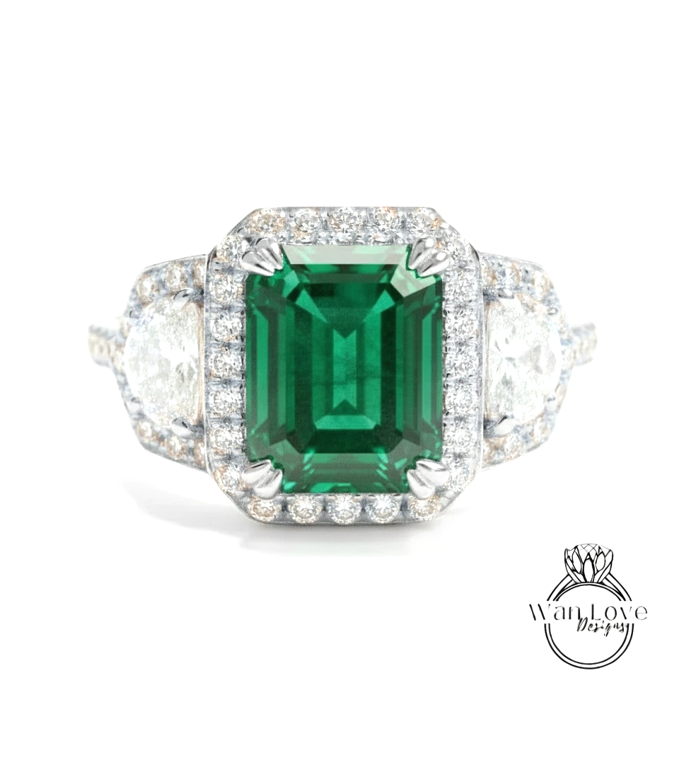 A stunning engagement ring with a large, vibrant green gemstone surrounded by a halo of sparkling diamonds.