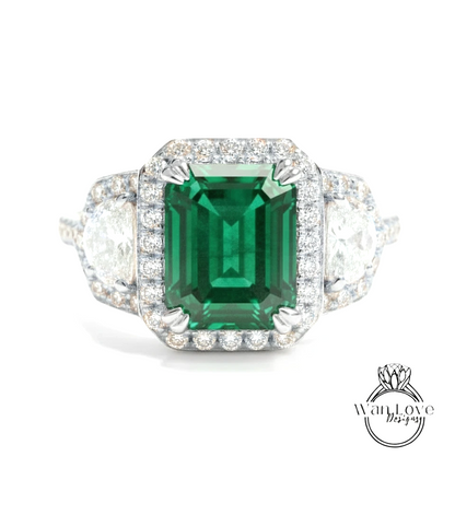 A stunning engagement ring with a large, vibrant green gemstone surrounded by a halo of sparkling diamonds.