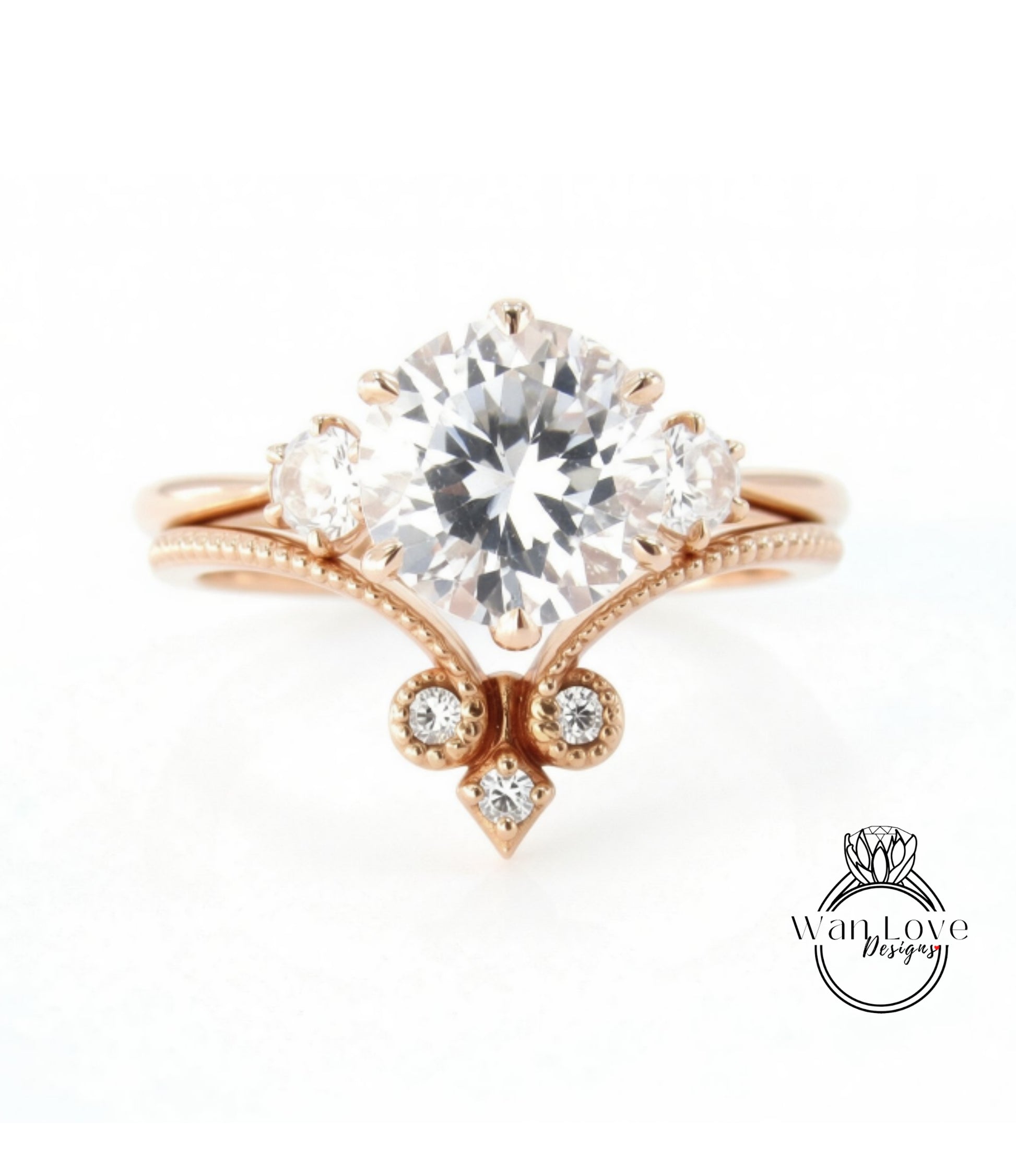 a beautiful engagement ring with a large central diamond surrounded by smaller diamonds on either side.