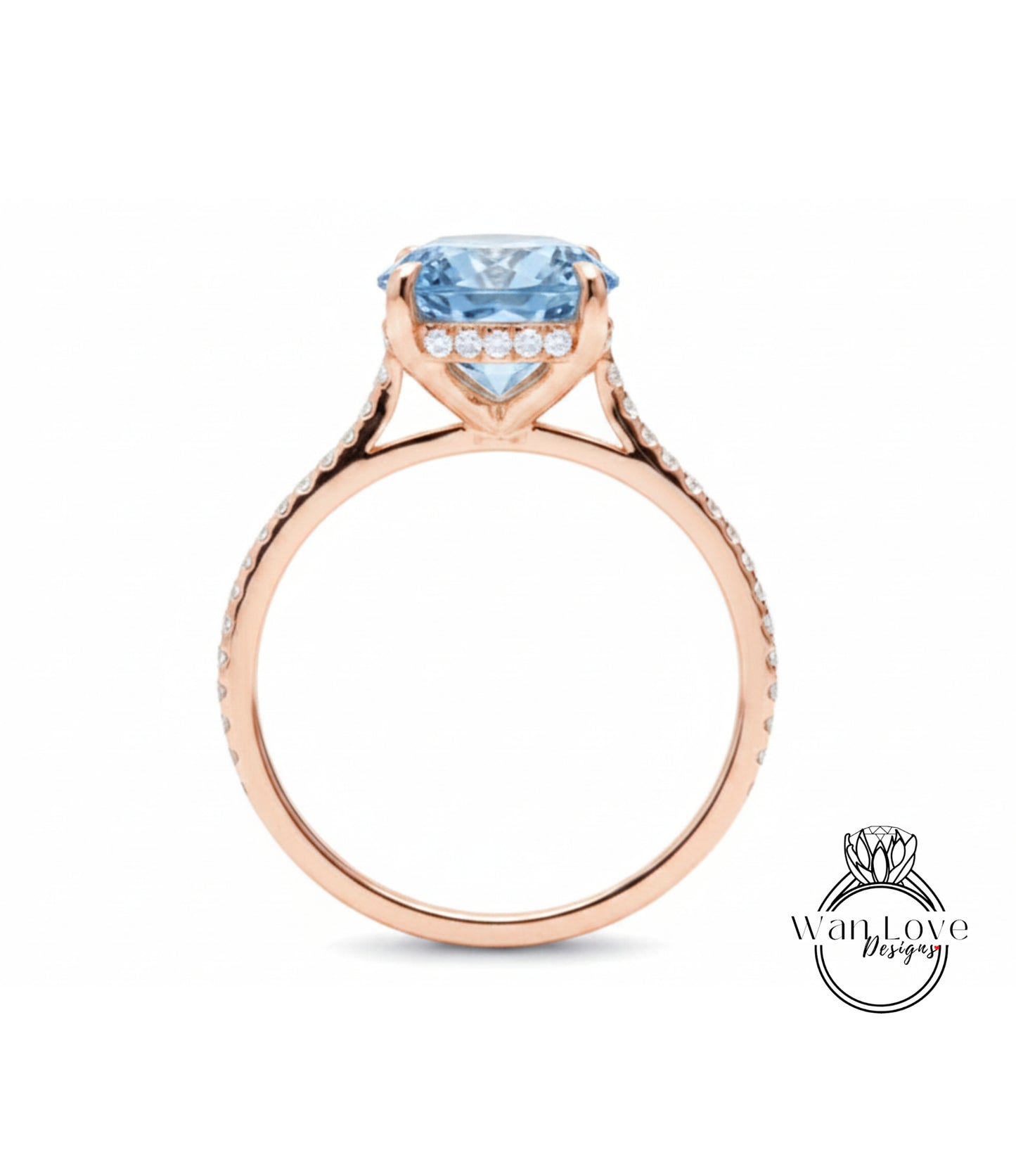A rose gold engagement ring with a large blue gemstone set in the center, surrounded by smaller diamonds.