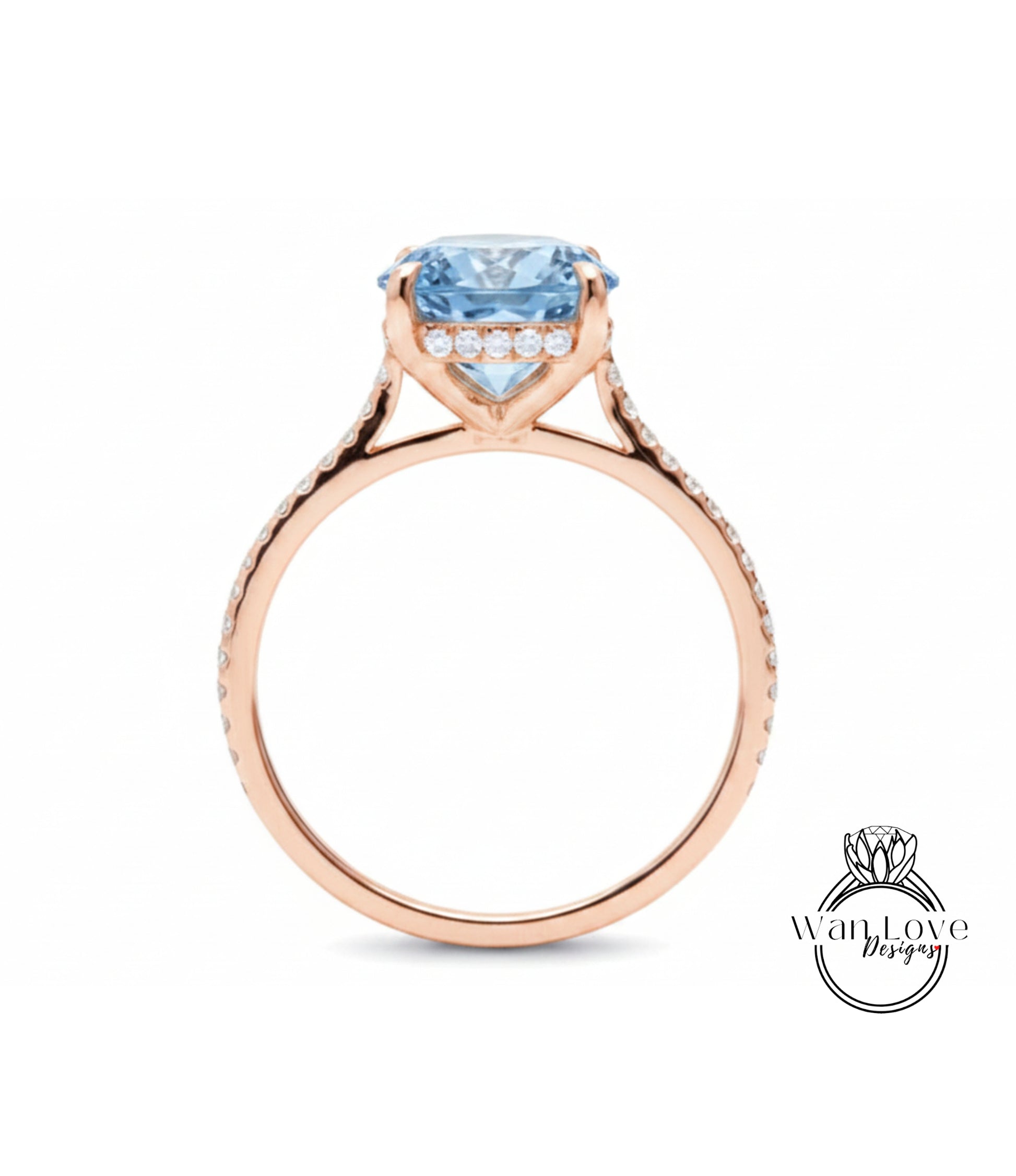 A rose gold engagement ring with a large blue gemstone set in the center, surrounded by smaller diamonds.