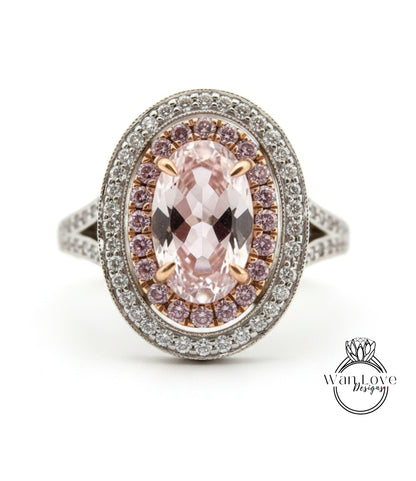 A close-up of a diamond ring with a large oval-shaped gemstone surrounded by smaller diamonds.