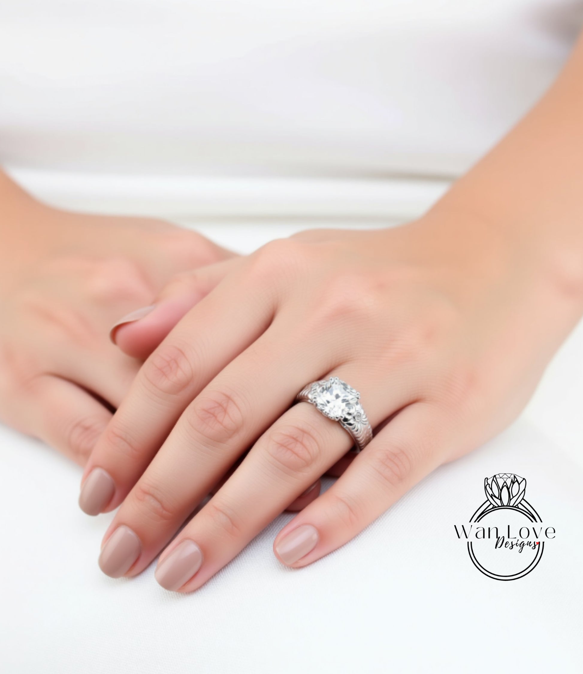 A close-up of a person's hand wearing a large diamond engagement ring.