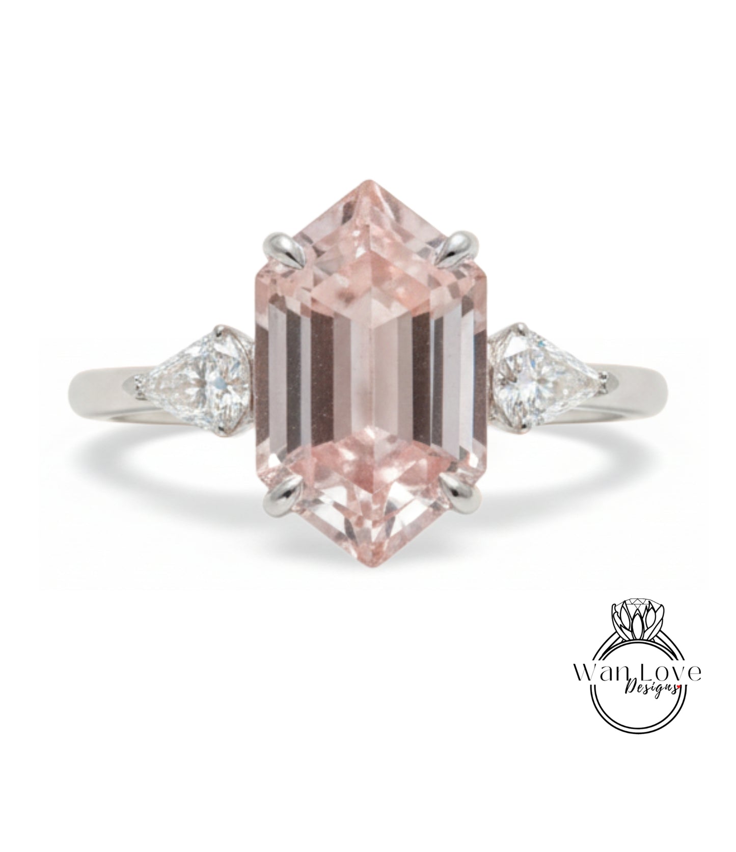 A beautiful engagement ring featuring a large, pink gemstone set in a silver band.
