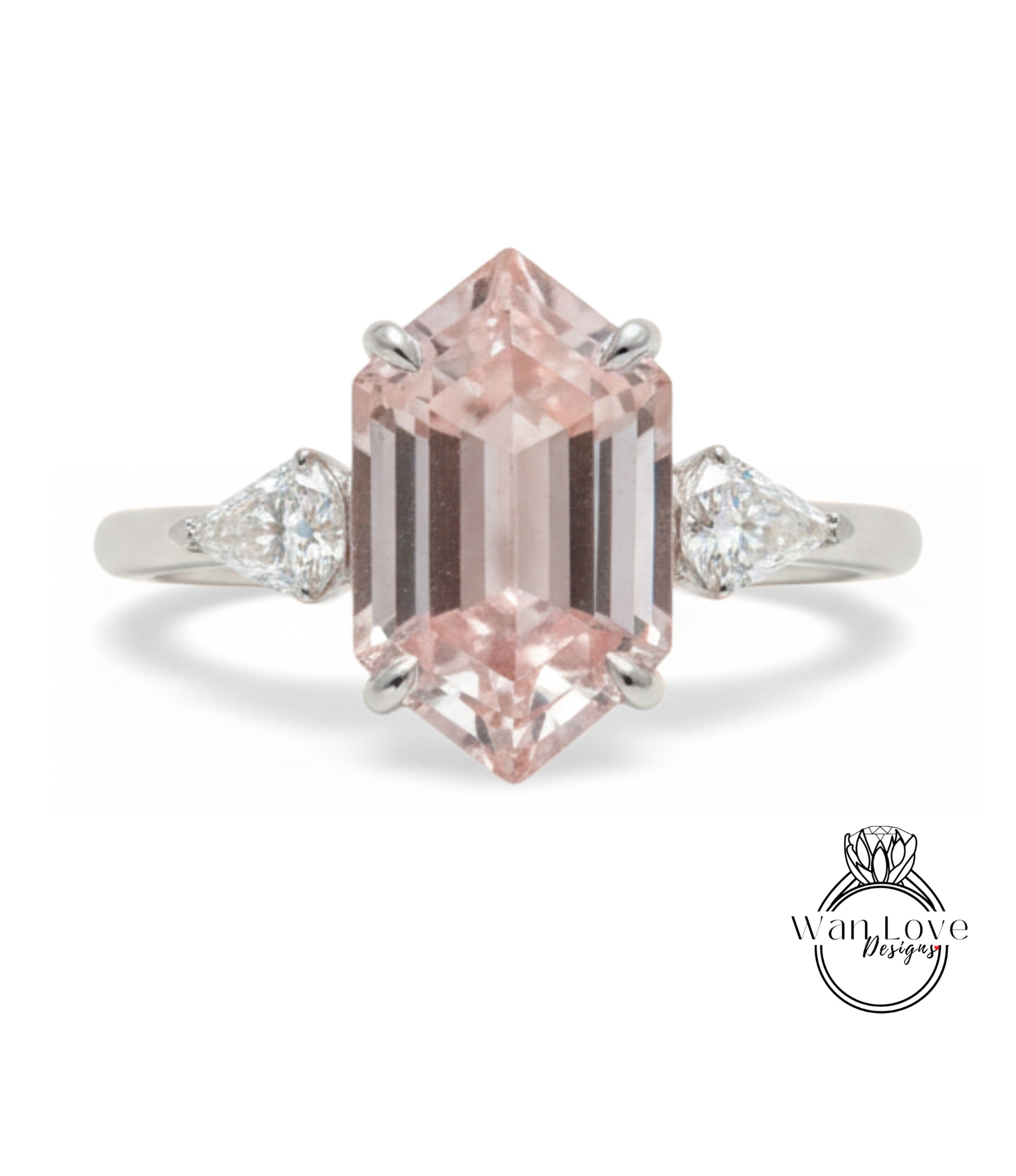 A beautiful engagement ring featuring a large, pink gemstone set in a silver band.
