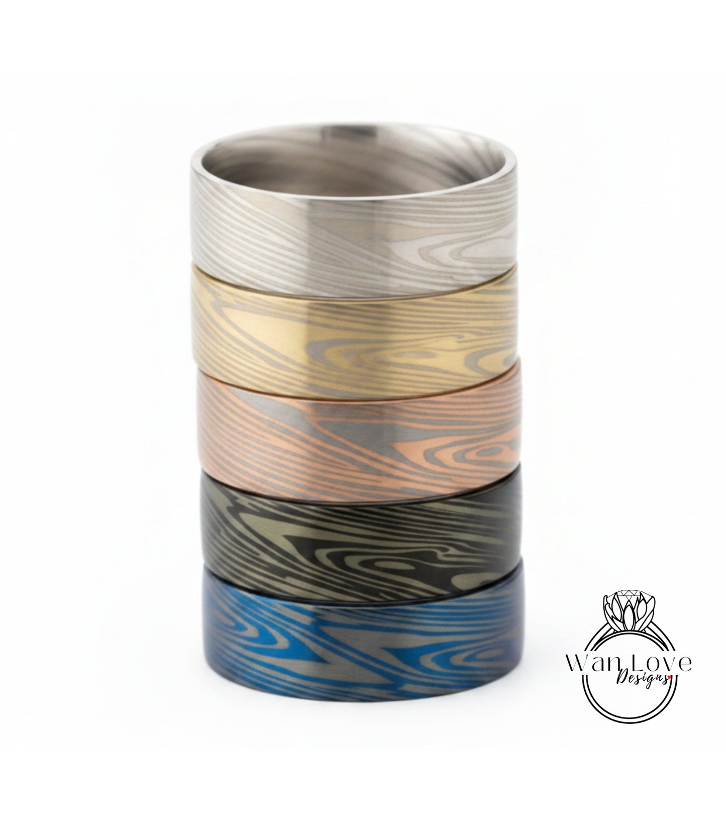 A stack of five rings with unique wood grain patterns in various colors, including silver, gold, bronze, blue, and black.