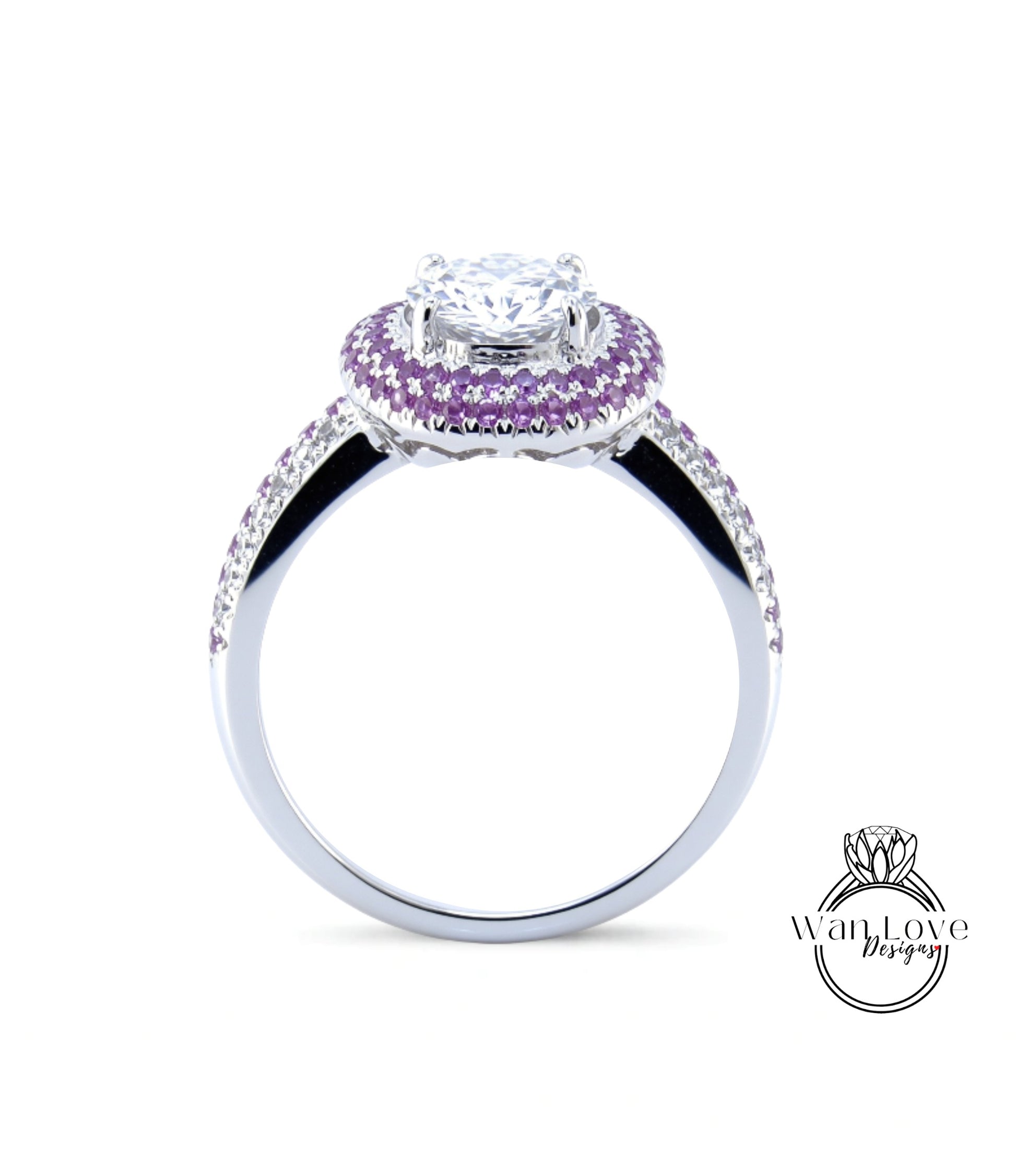 A silver ring with a large central diamond surrounded by a halo of smaller diamonds and purple gemstones.