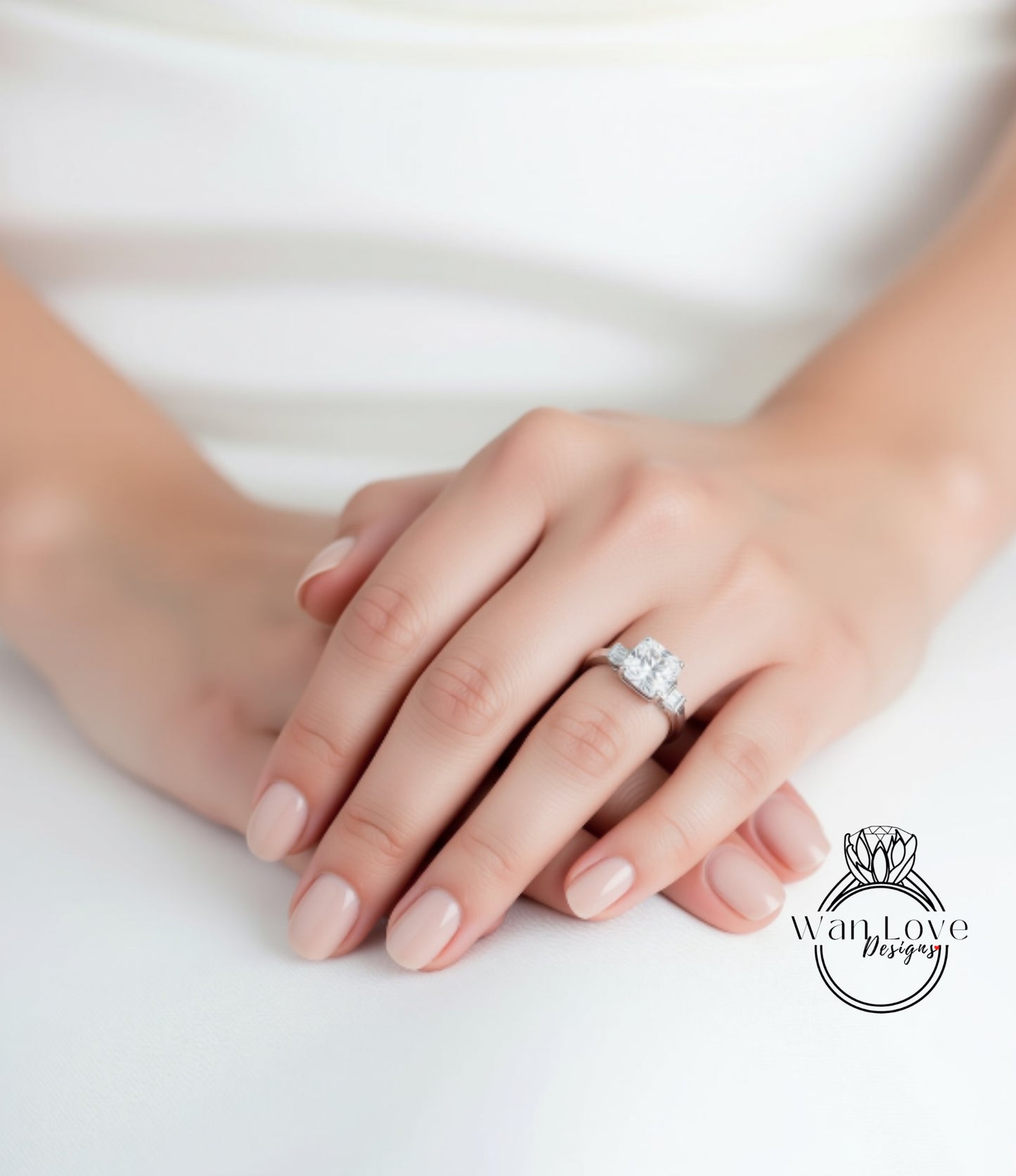 A close-up of a person's hands wearing a diamond engagement ring.
