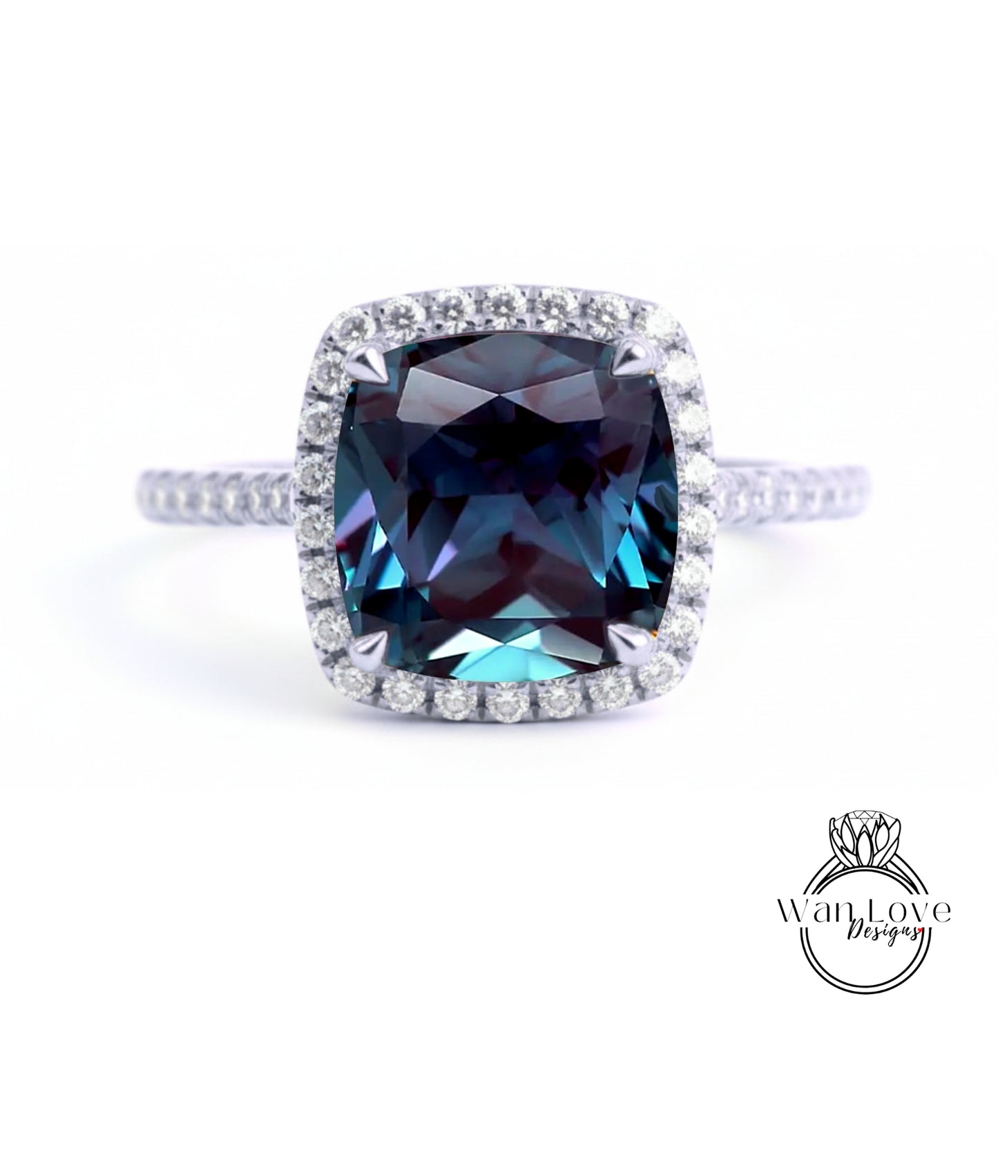 A stunning blue gemstone ring with a halo of diamonds around the center stone.