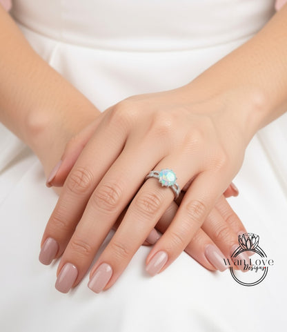 A close-up image of a person's hands wearing a ring with a large, colorful gemstone.