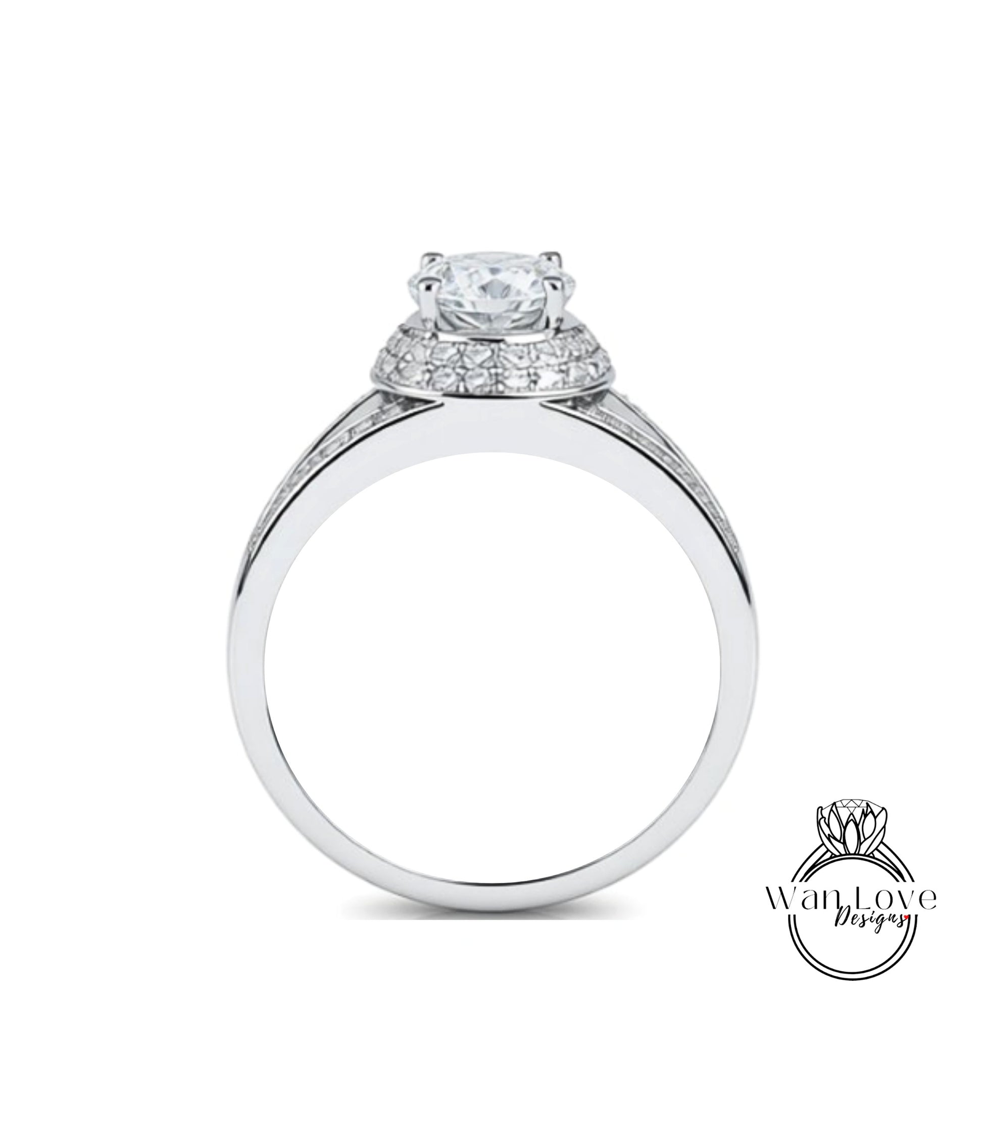 A silver engagement ring with a large central diamond surrounded by smaller diamonds on the band.