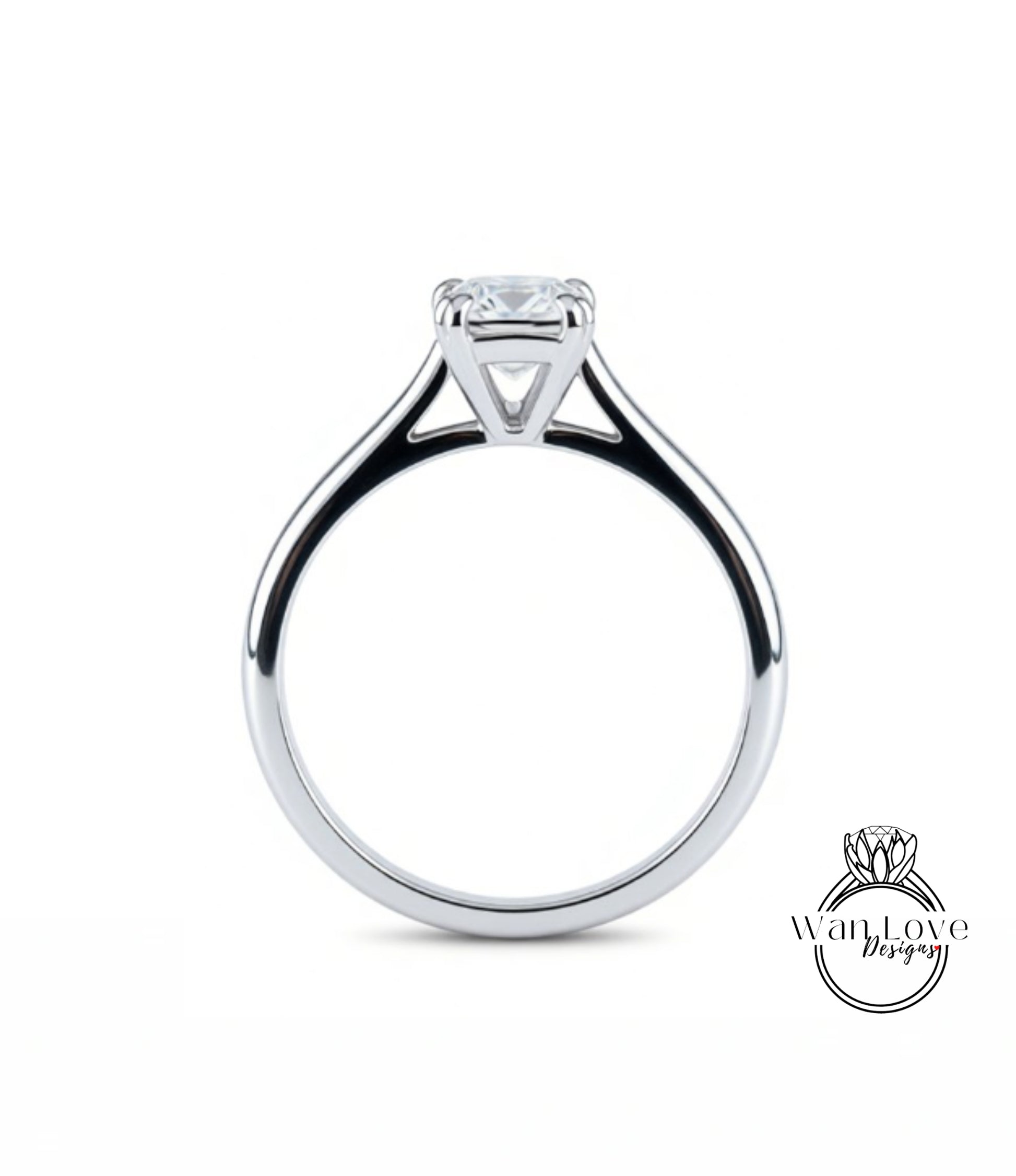 A silver engagement ring with a large central diamond.