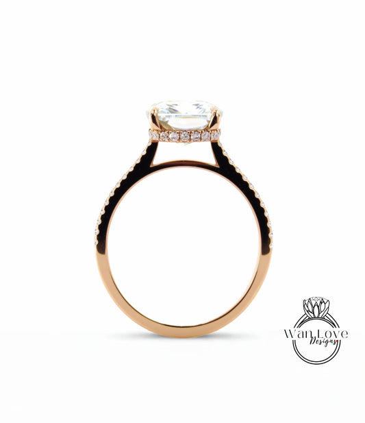 A gold ring with a large diamond set in the center, surrounded by smaller diamonds.