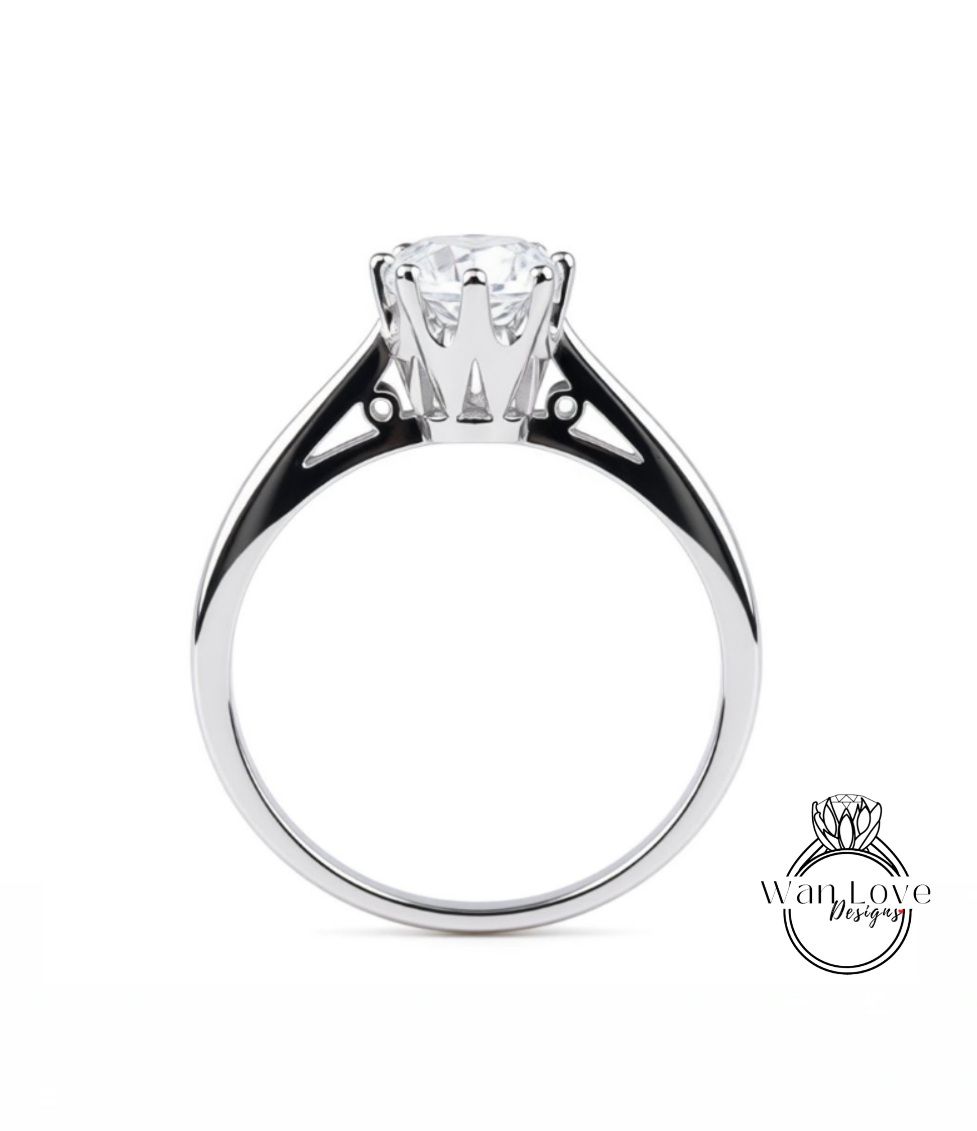 A silver engagement ring with a large central diamond and a smaller diamond on either side.