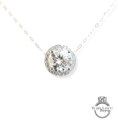 A necklace with a large, round diamond pendant set in a halo of smaller diamonds.