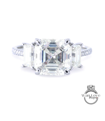 A close-up of a diamond engagement ring with a large, clear gemstone set in a silver band.