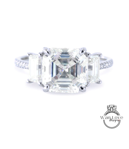 A close-up of a diamond engagement ring with a large, clear gemstone set in a silver band.