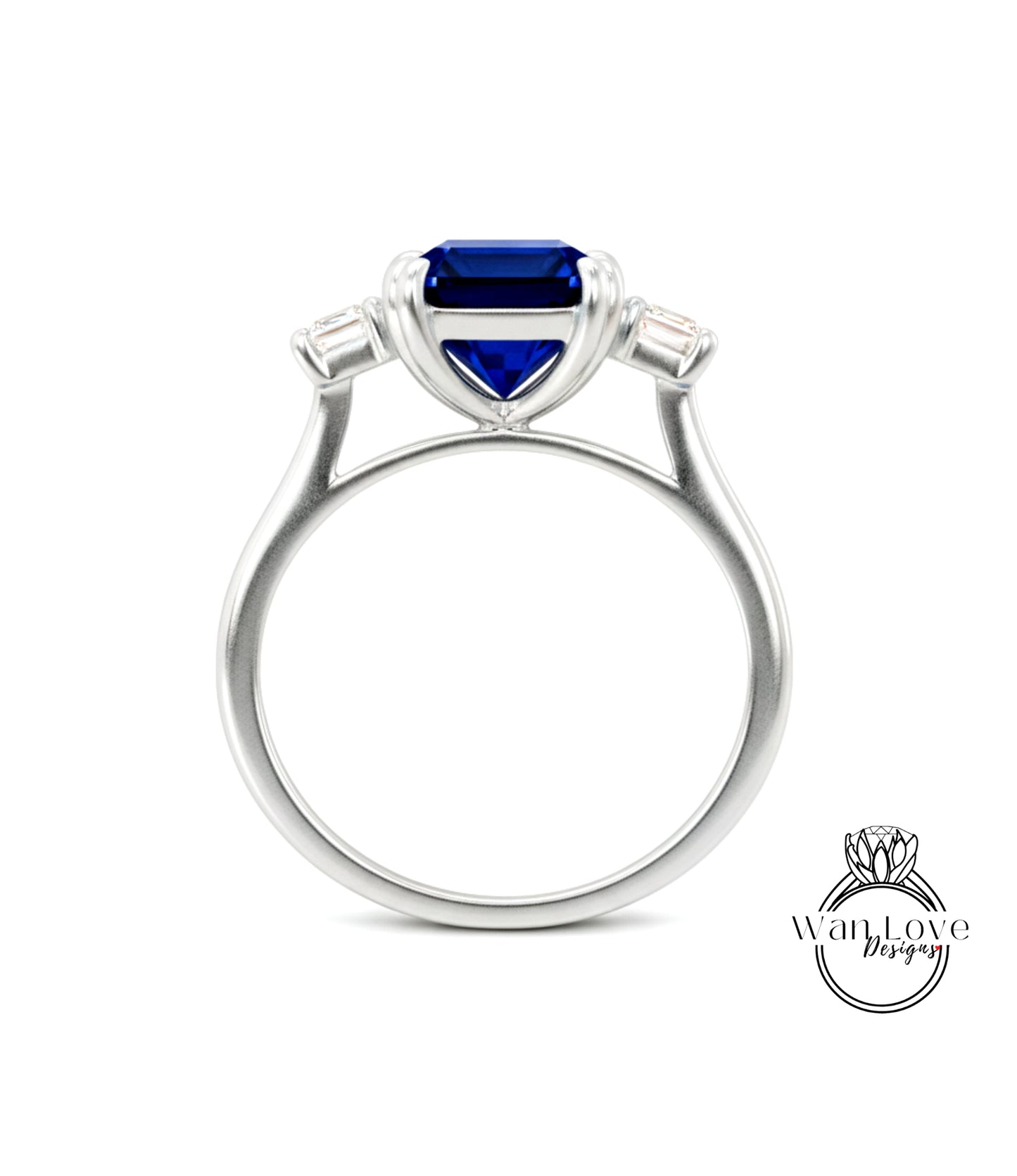 A silver ring with a large blue gemstone, possibly a sapphire, set in the center.