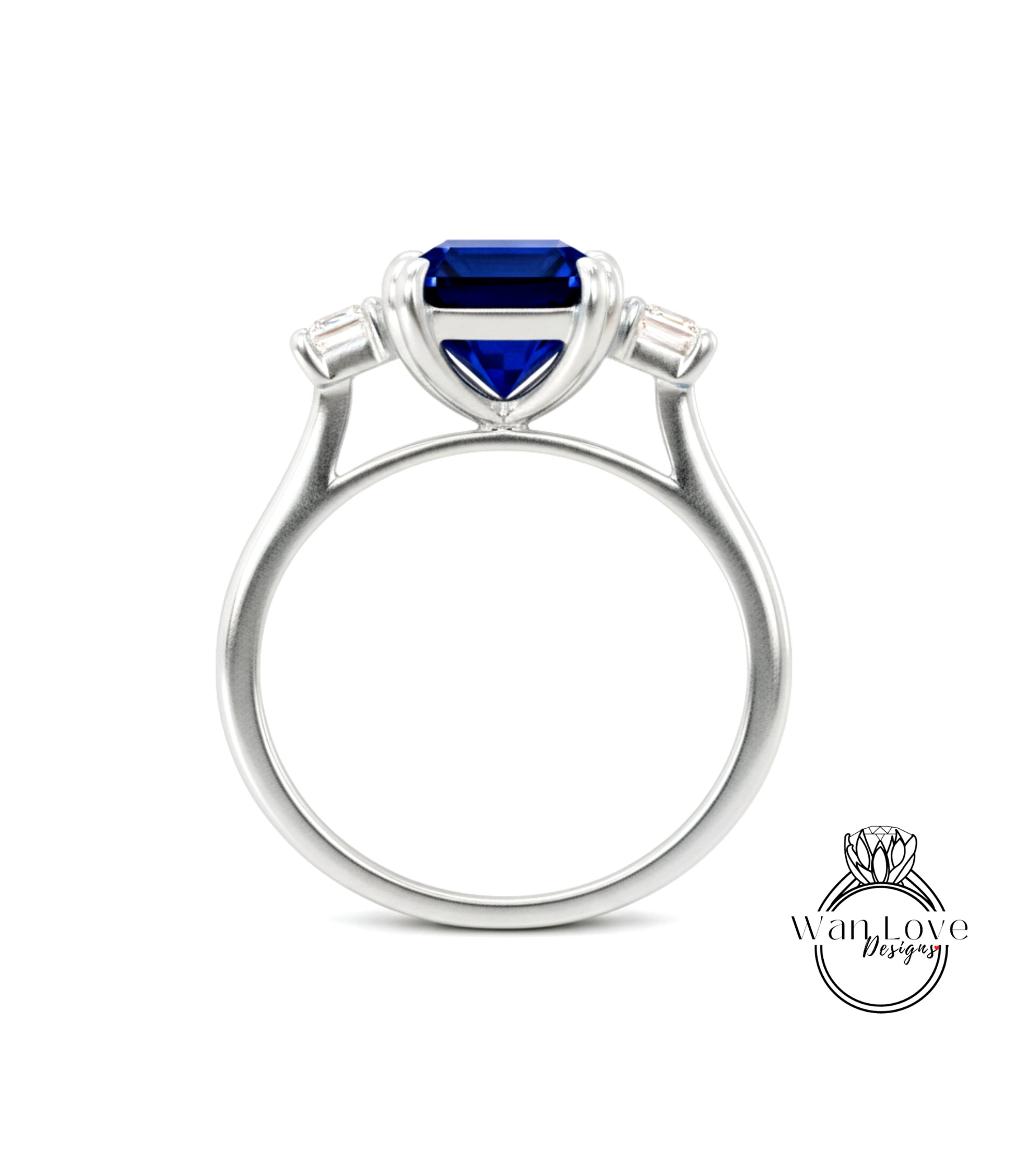 A silver ring with a large blue gemstone, possibly a sapphire, set in the center.