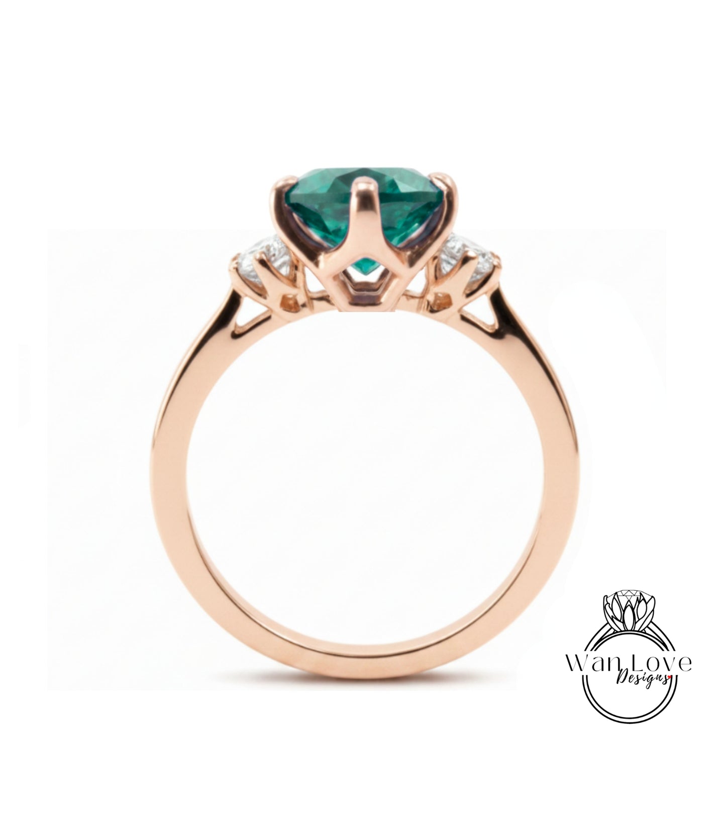 A gold ring with a large, green gemstone set in the center.