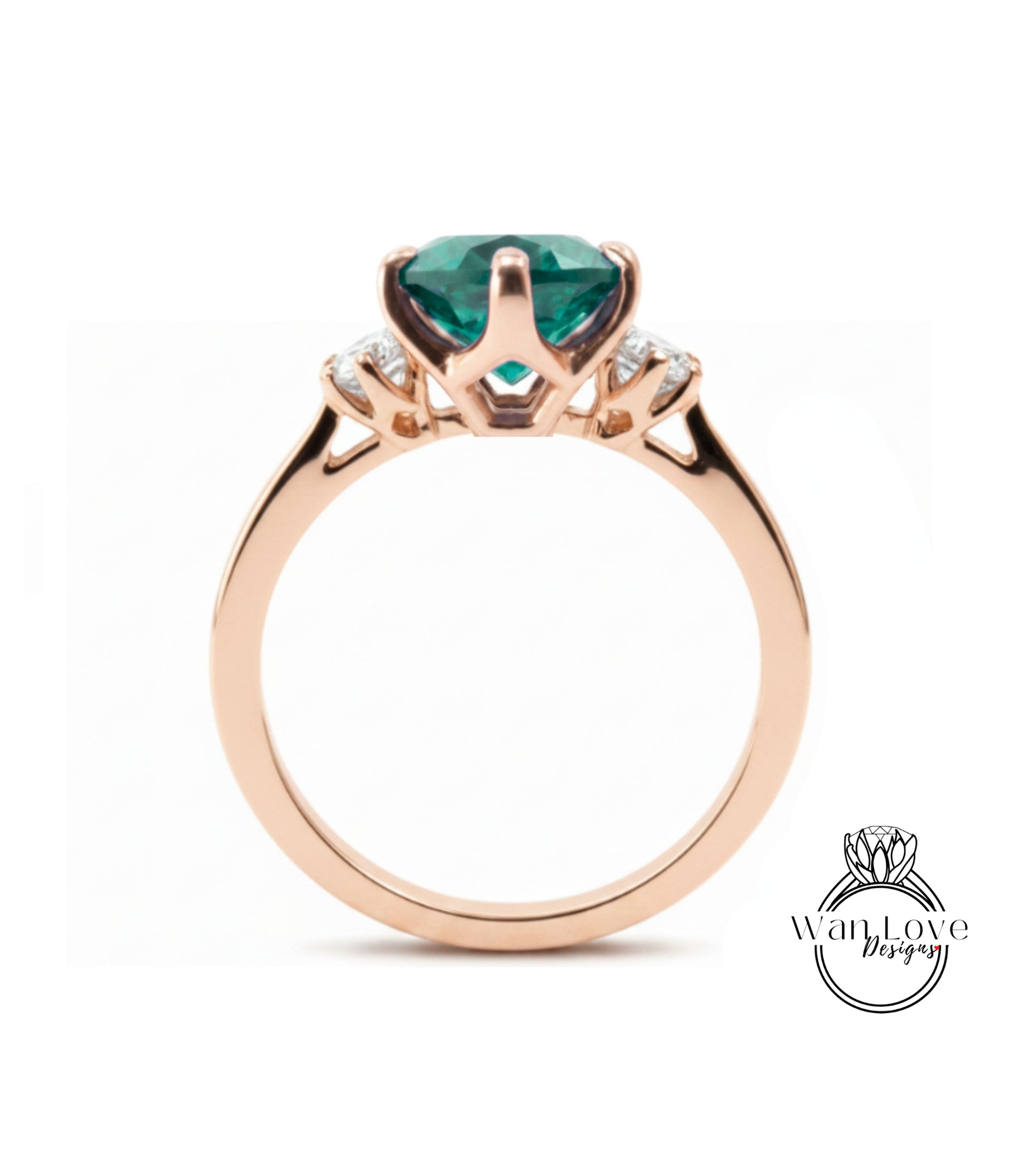 A gold ring with a large, green gemstone set in the center.