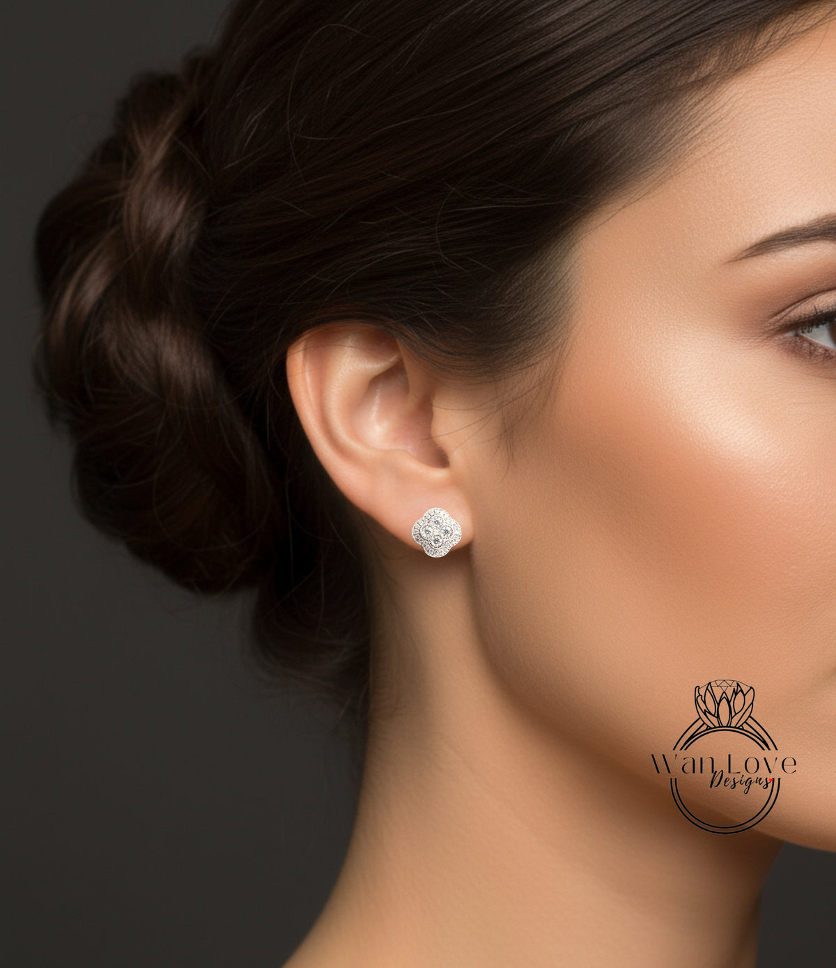A close-up of a woman's face, focusing on her ear with a diamond earring.