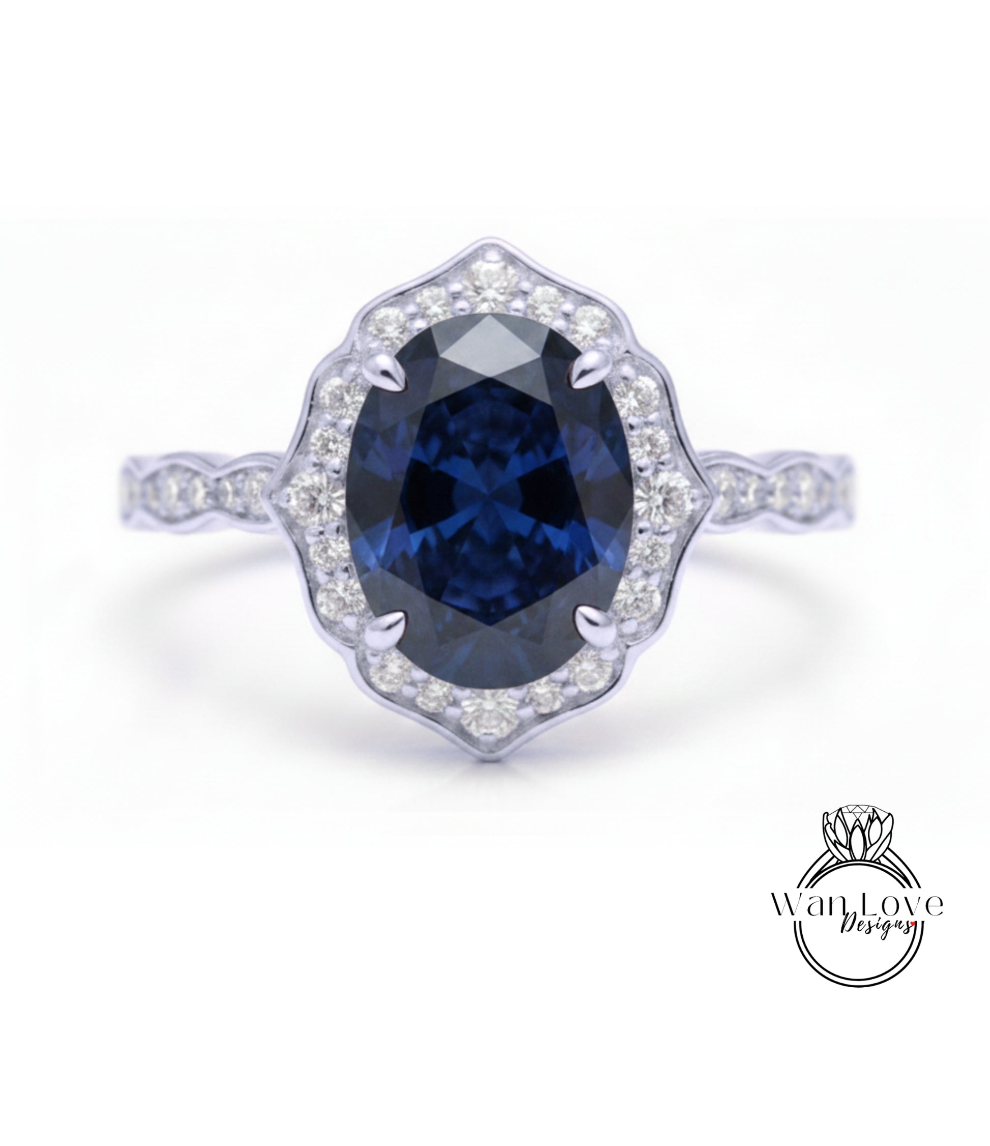 A close-up of a silver ring with a large oval-shaped blue gemstone at the center, surrounded by smaller diamonds.