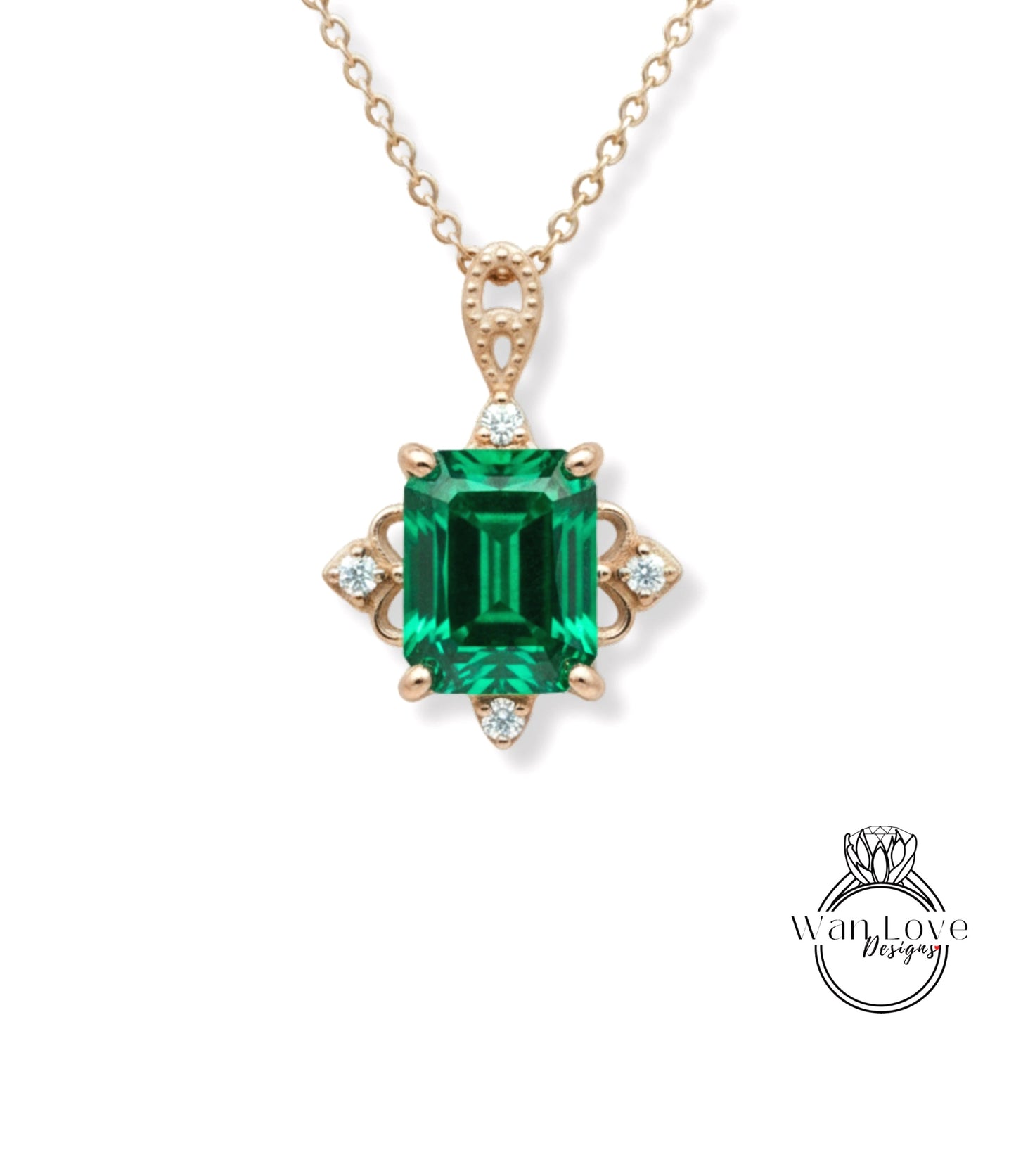 A gold necklace with a large, green gemstone pendant.