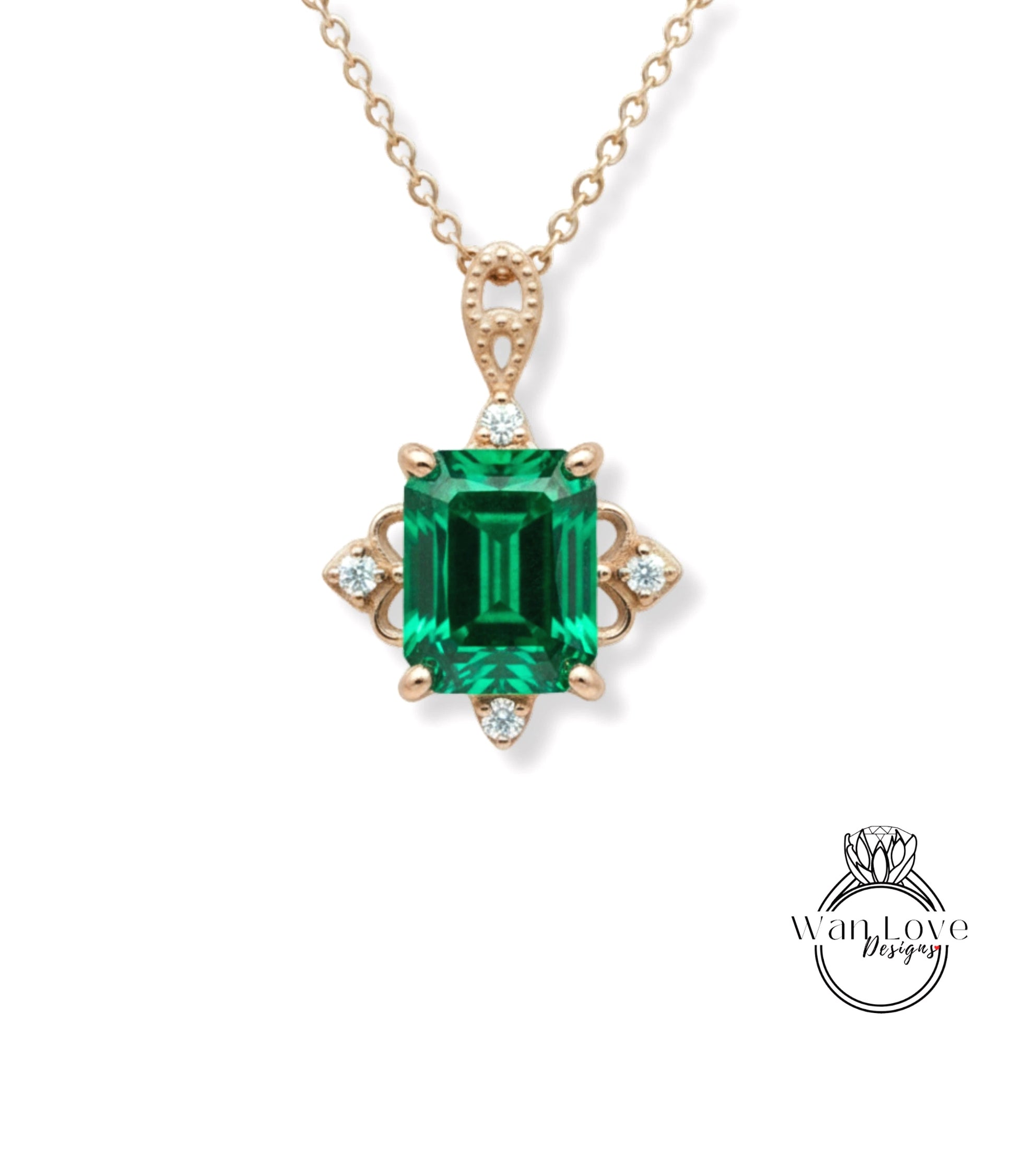 A gold necklace with a large, green gemstone pendant.