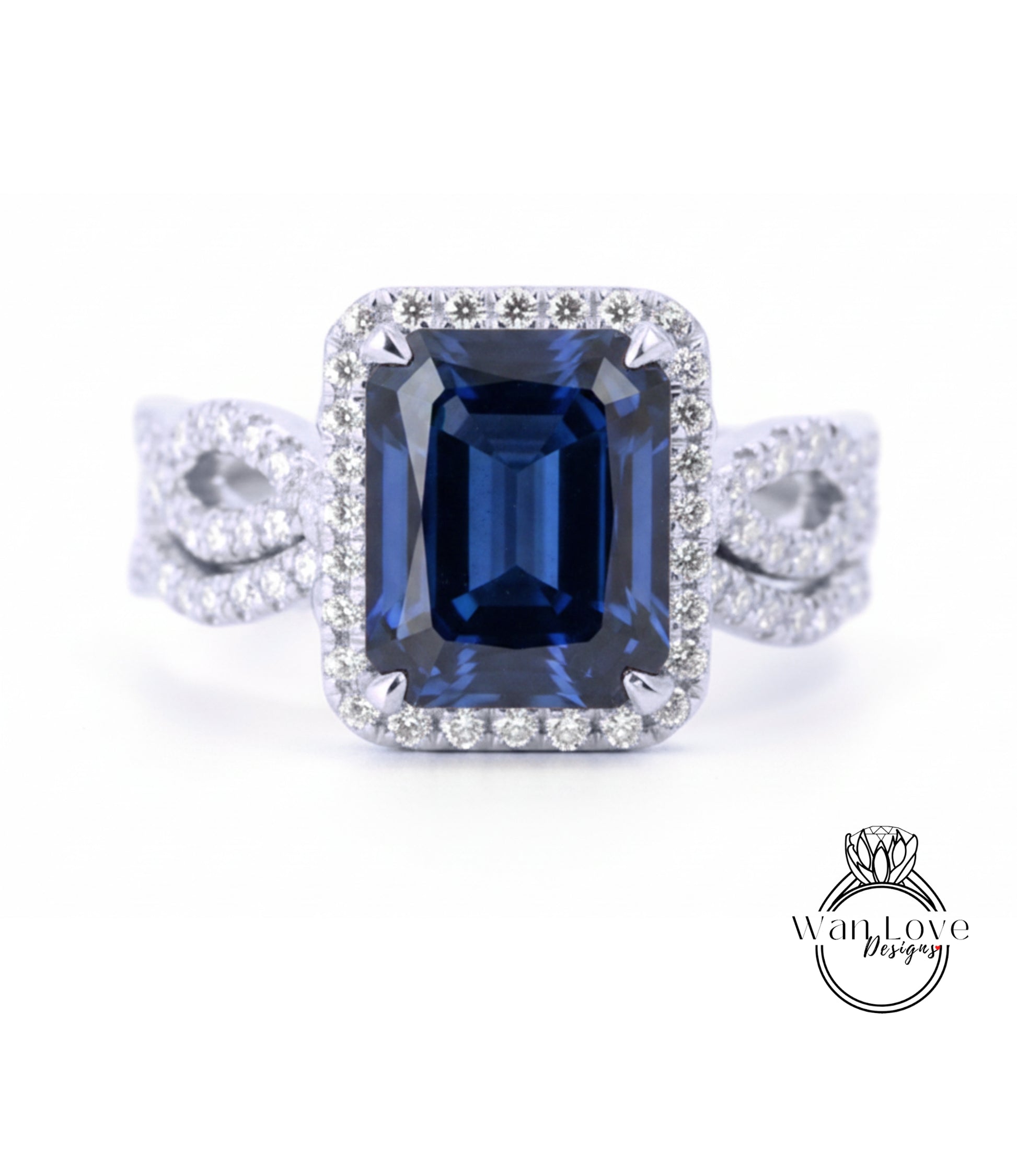 A stunning diamond engagement ring with a large blue gemstone set in a halo of smaller diamonds.