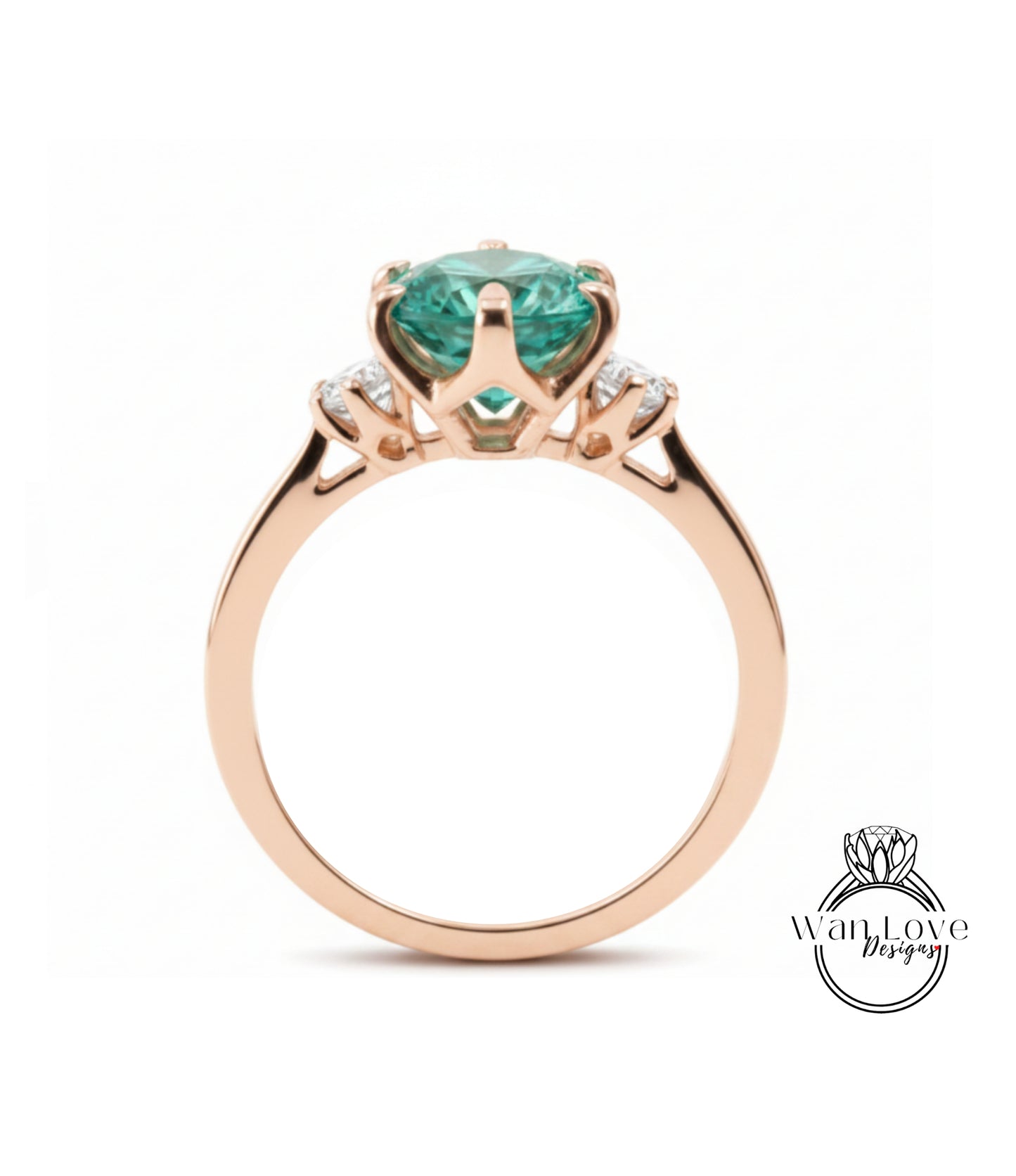 A gold ring with a large, green gemstone set in the center.