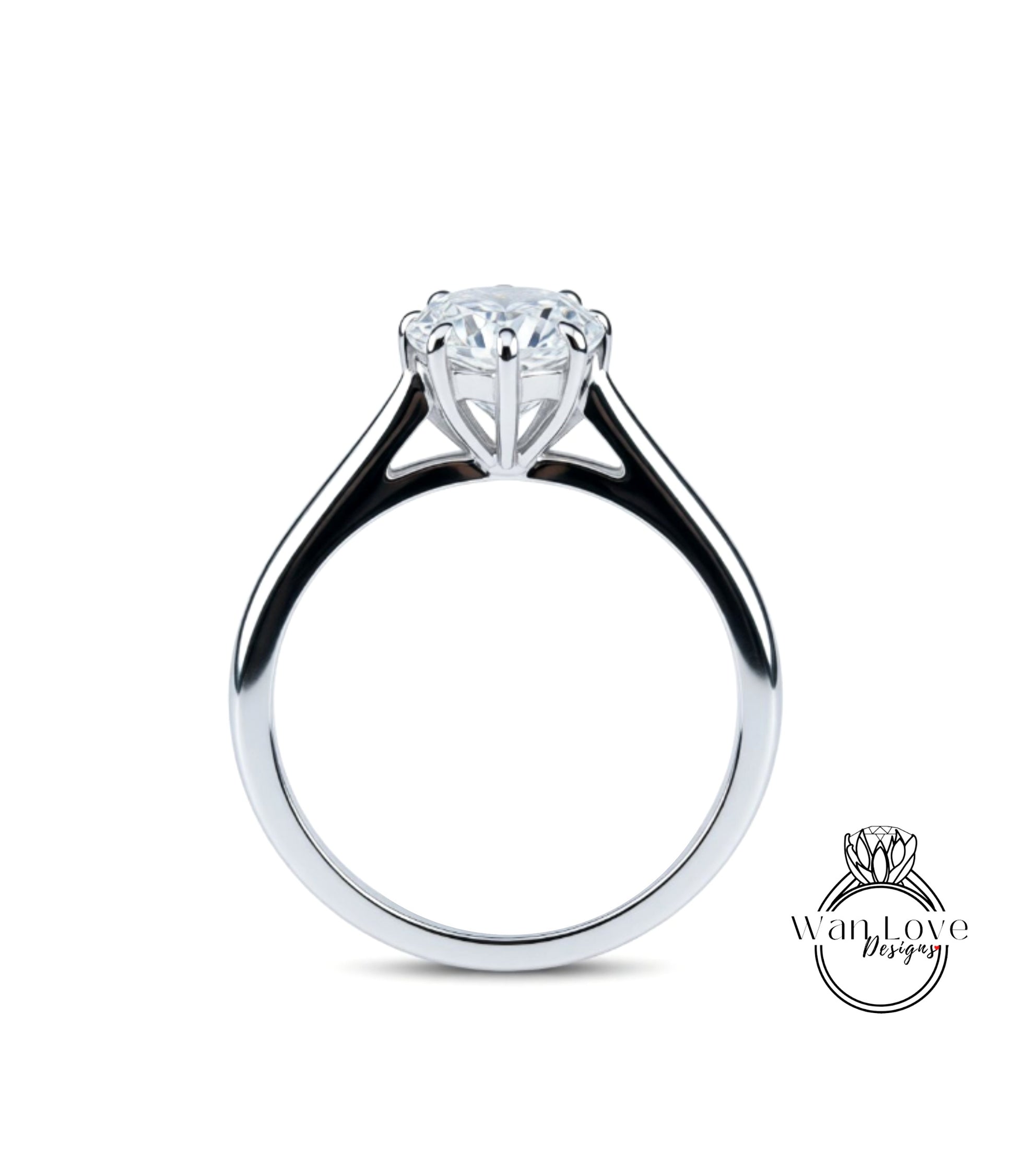 A silver engagement ring with a large central diamond and a smaller diamond on either side.