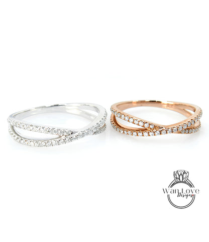 two rings, one silver and one gold, both adorned with small diamonds.