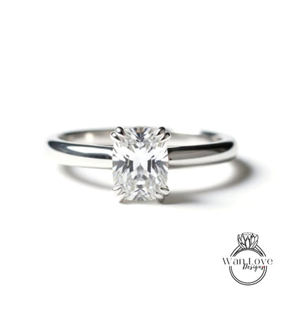 A close-up view of a diamond engagement ring with a large, clear gemstone set in a silver band.