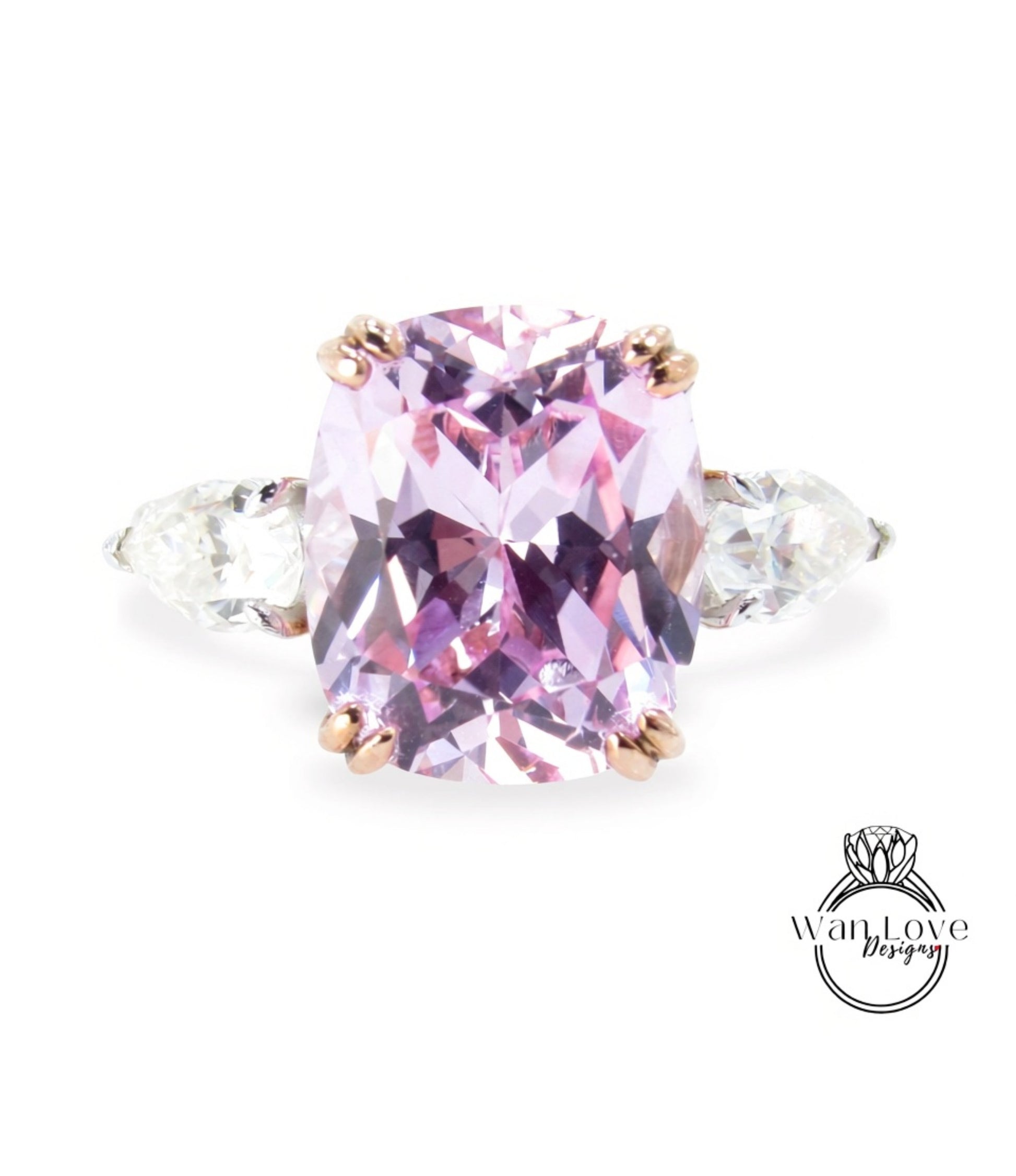A large, oval-shaped pink gemstone set in a ring, with two smaller diamonds on either side.