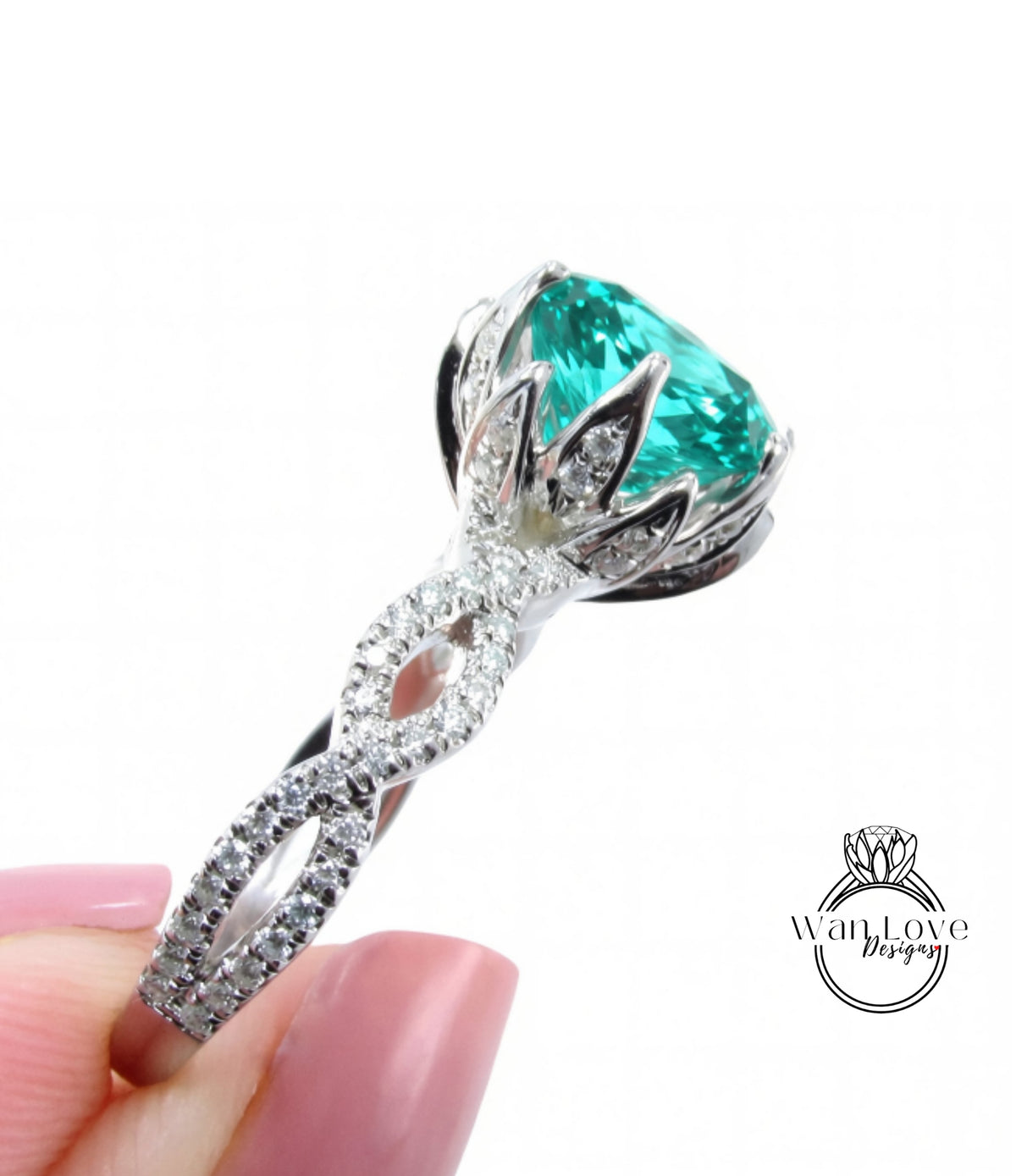 A close-up of a silver ring with a large, turquoise gemstone, possibly a diamond, set in a decorative design.
