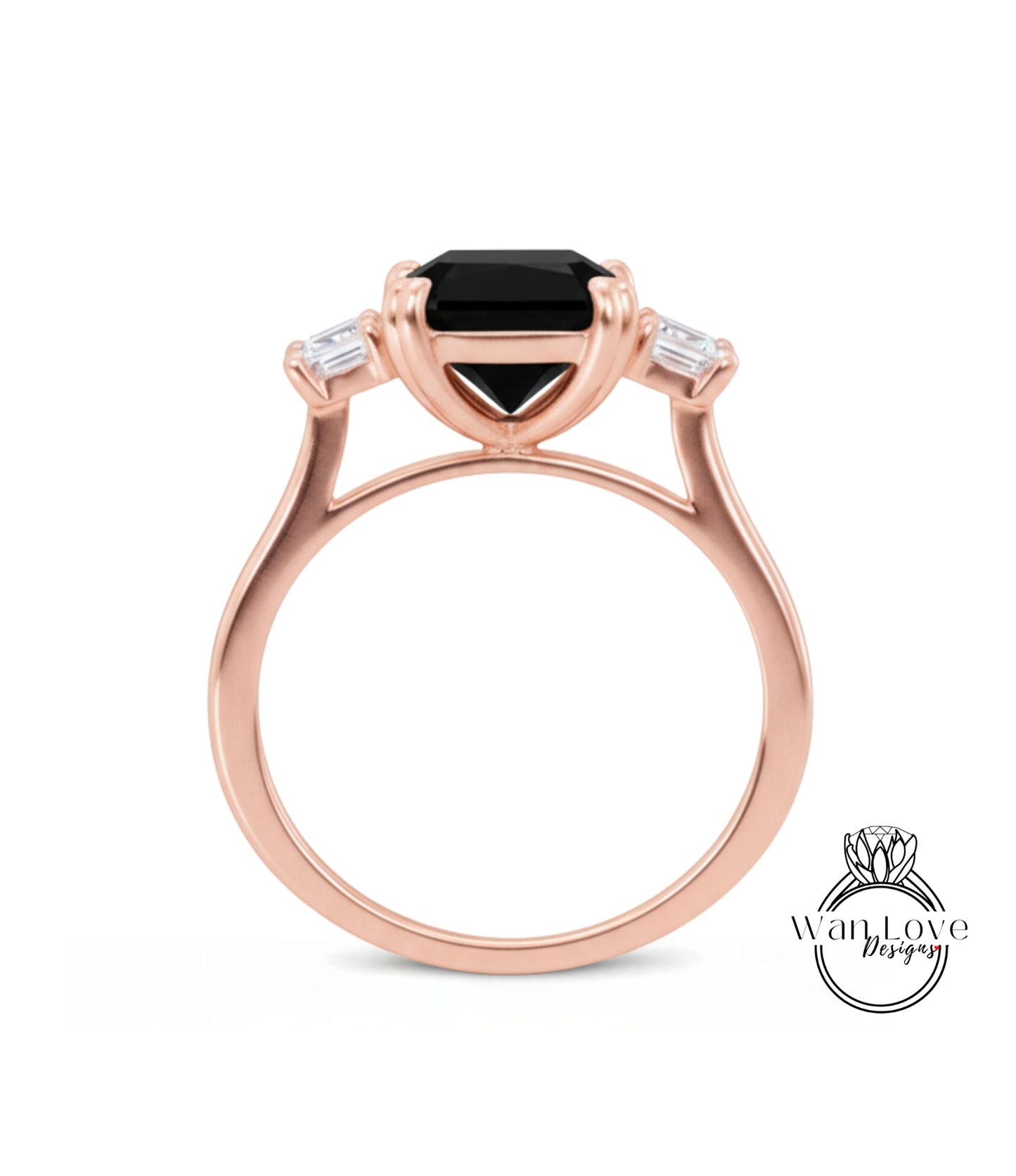 A rose gold ring with a large black gemstone set in the center, surrounded by smaller diamonds.