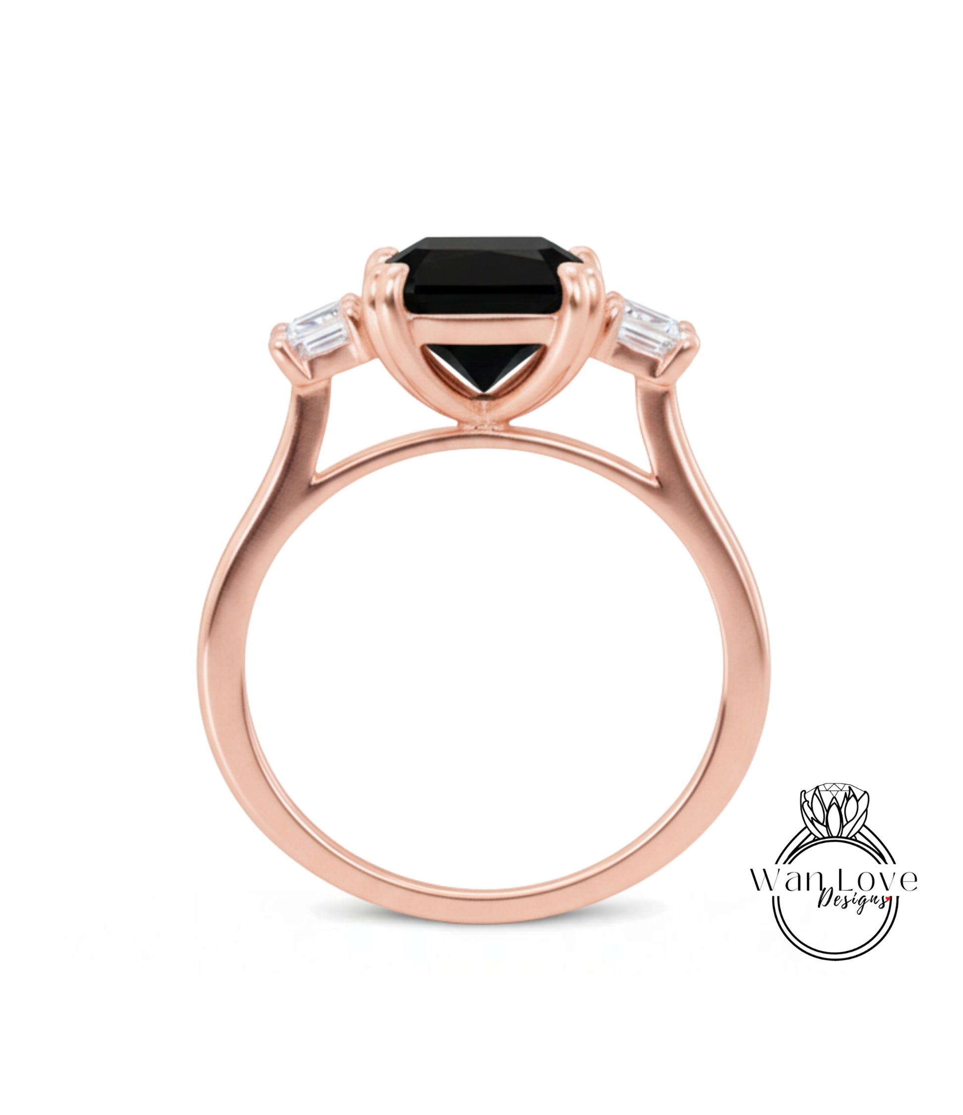 A rose gold ring with a large black gemstone set in the center, surrounded by smaller diamonds.