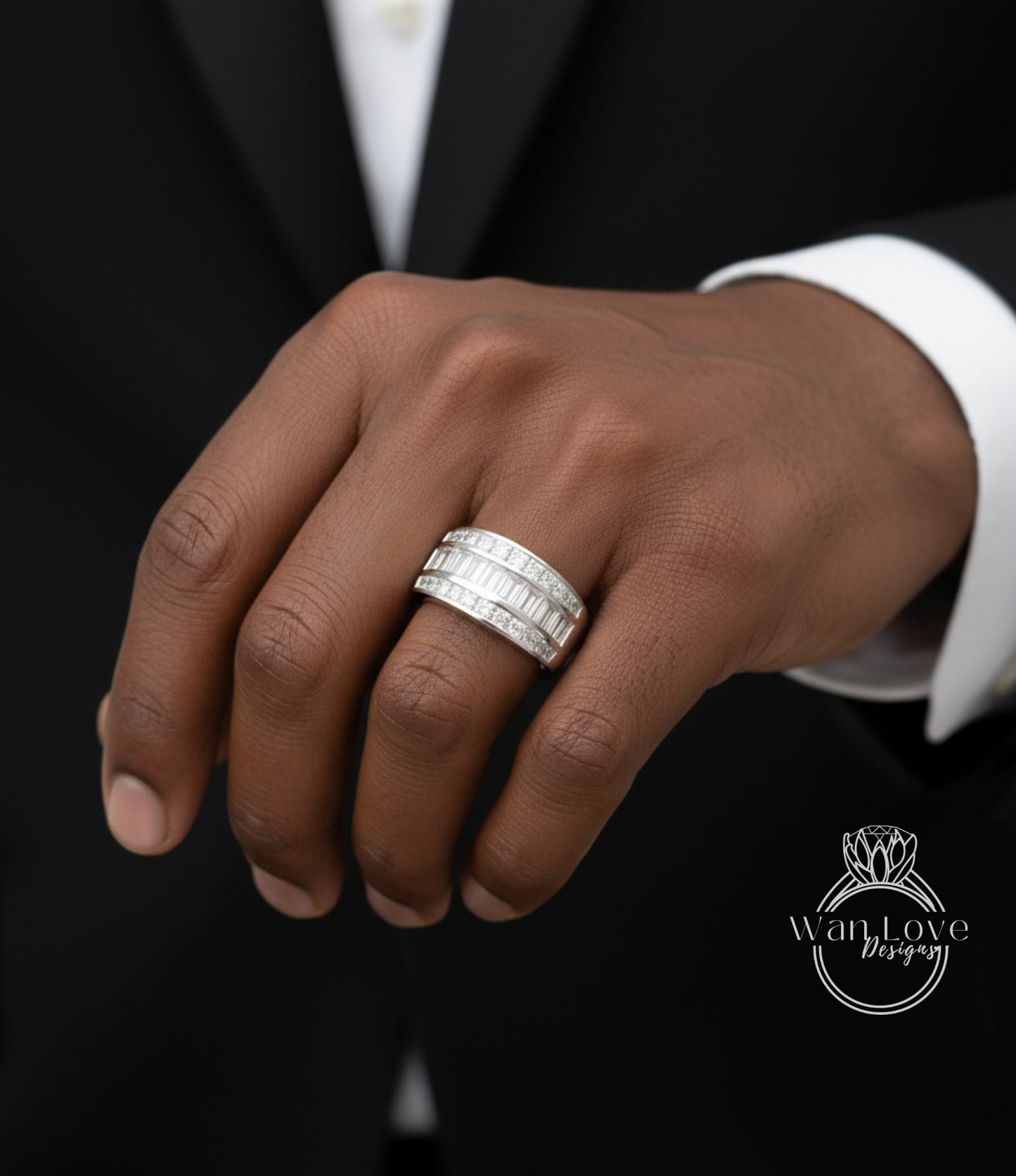 A close-up of a person's hand wearing a large, multi-band diamond ring.