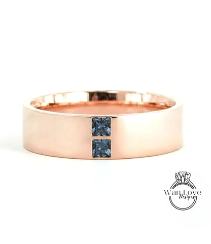 A rose gold ring with a large central gemstone and two smaller stones on either side.