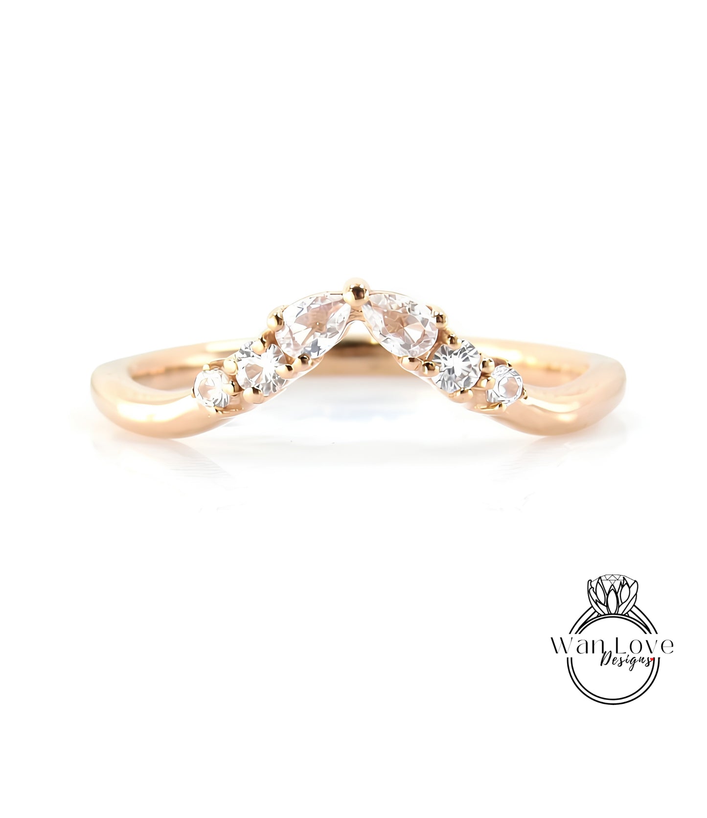 A gold ring with a diamond-encrusted band, featuring a v-shaped design with multiple small diamonds set in the center.