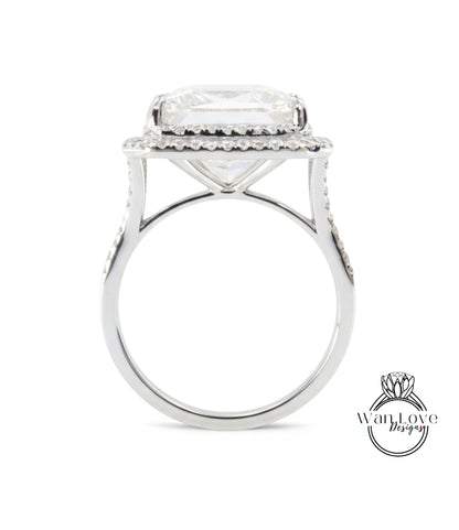 A large, white diamond engagement ring with a halo of smaller diamonds around the center stone.