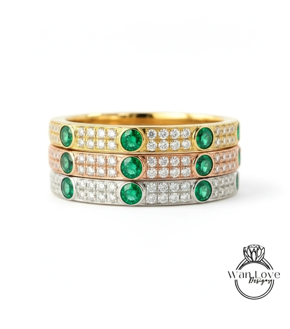 A stack of three rings with green and white gemstones set in gold and silver.