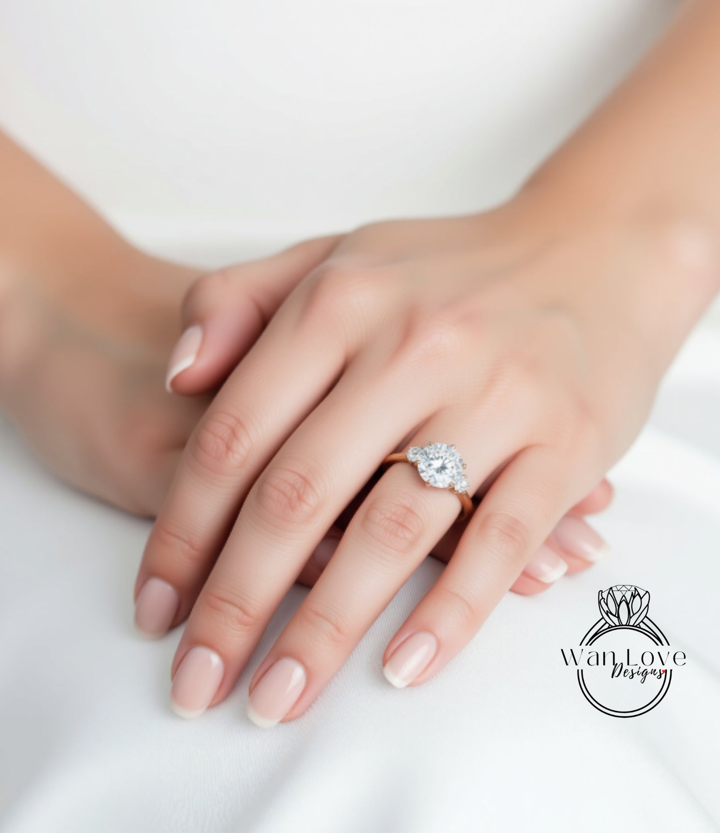 A close-up of a person's hand wearing a diamond engagement ring.
